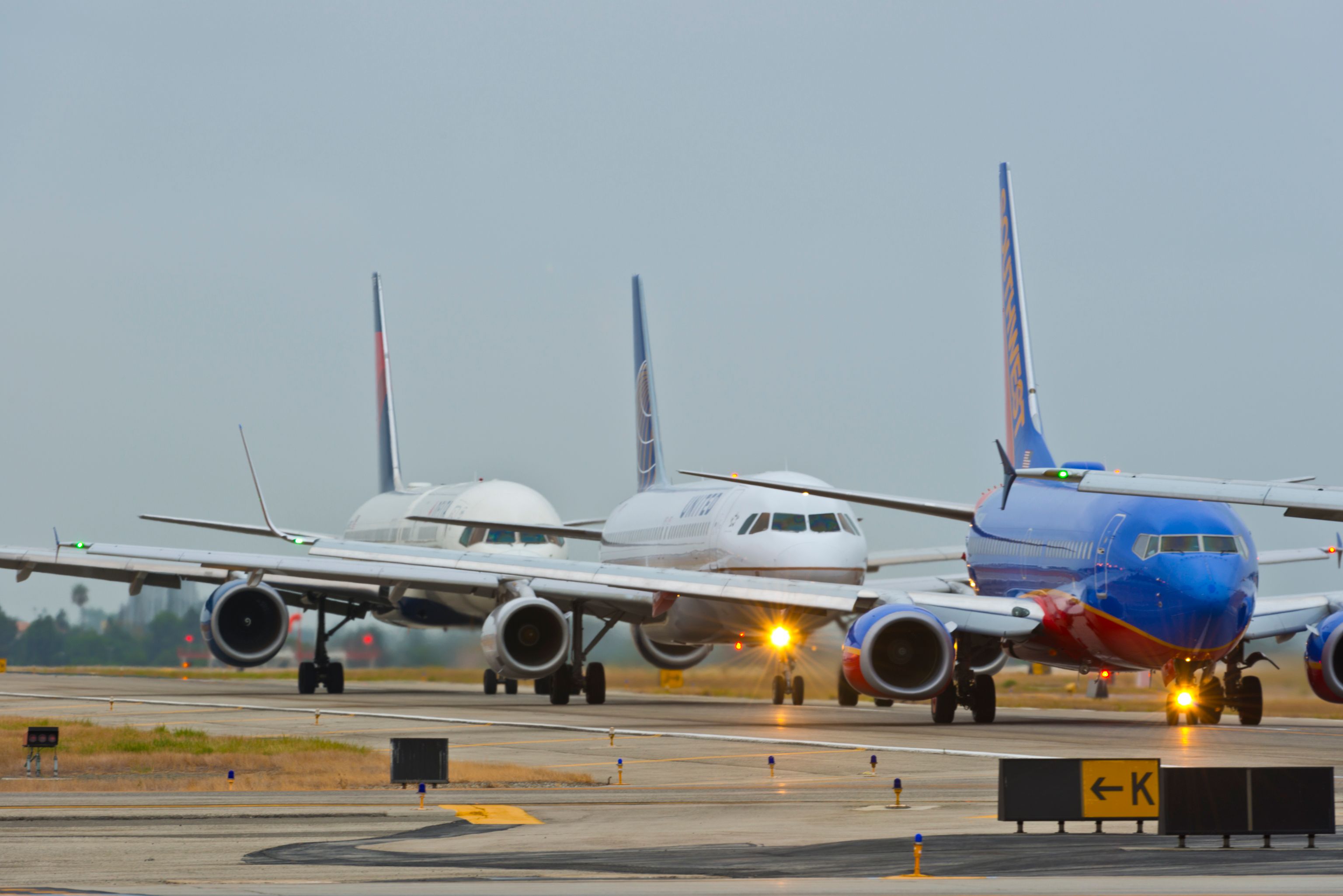 Aircraft lined up for departure at John Wayne Airport.