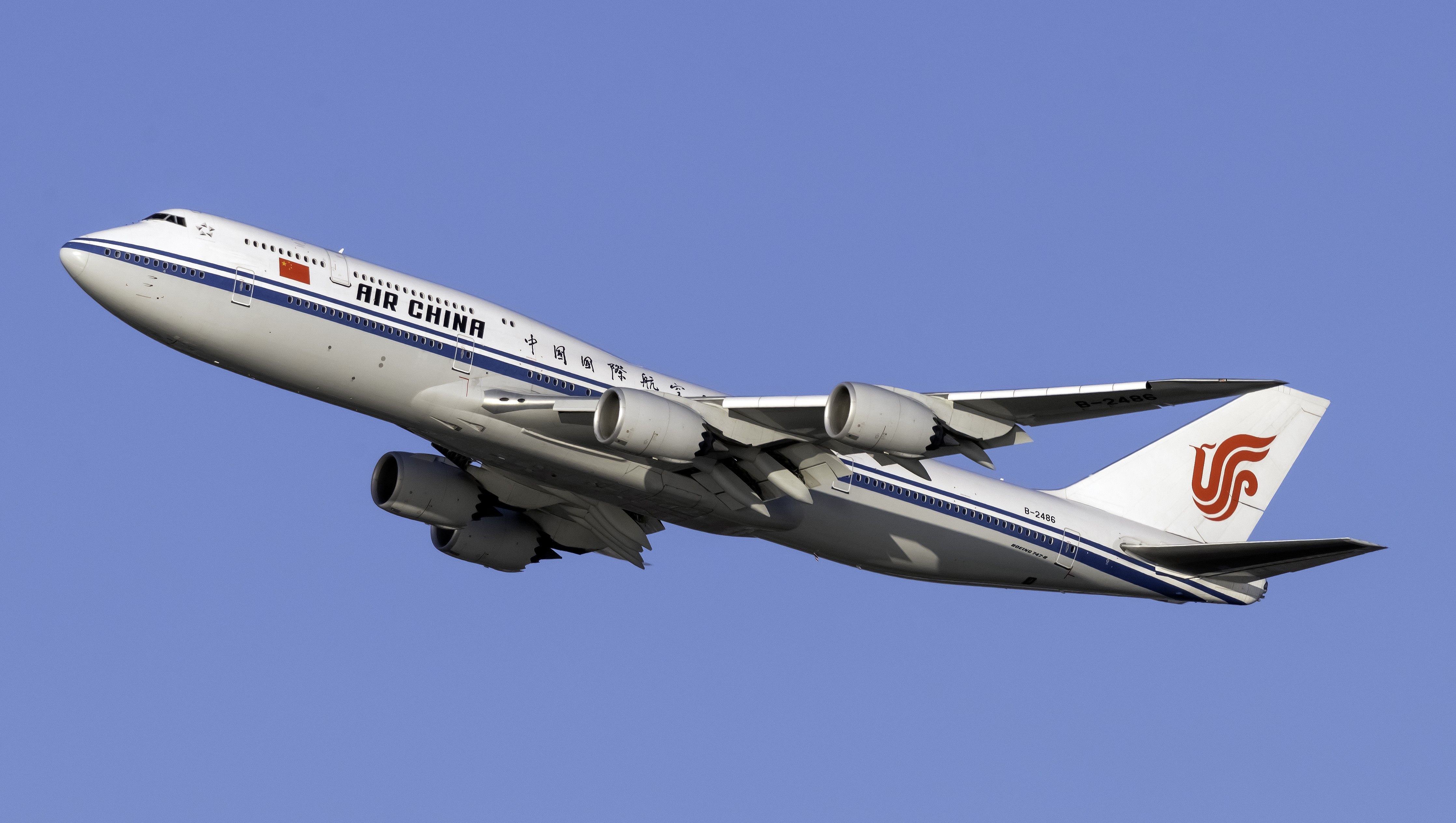 A Boeing 747-8 of Air China flies in the sky.