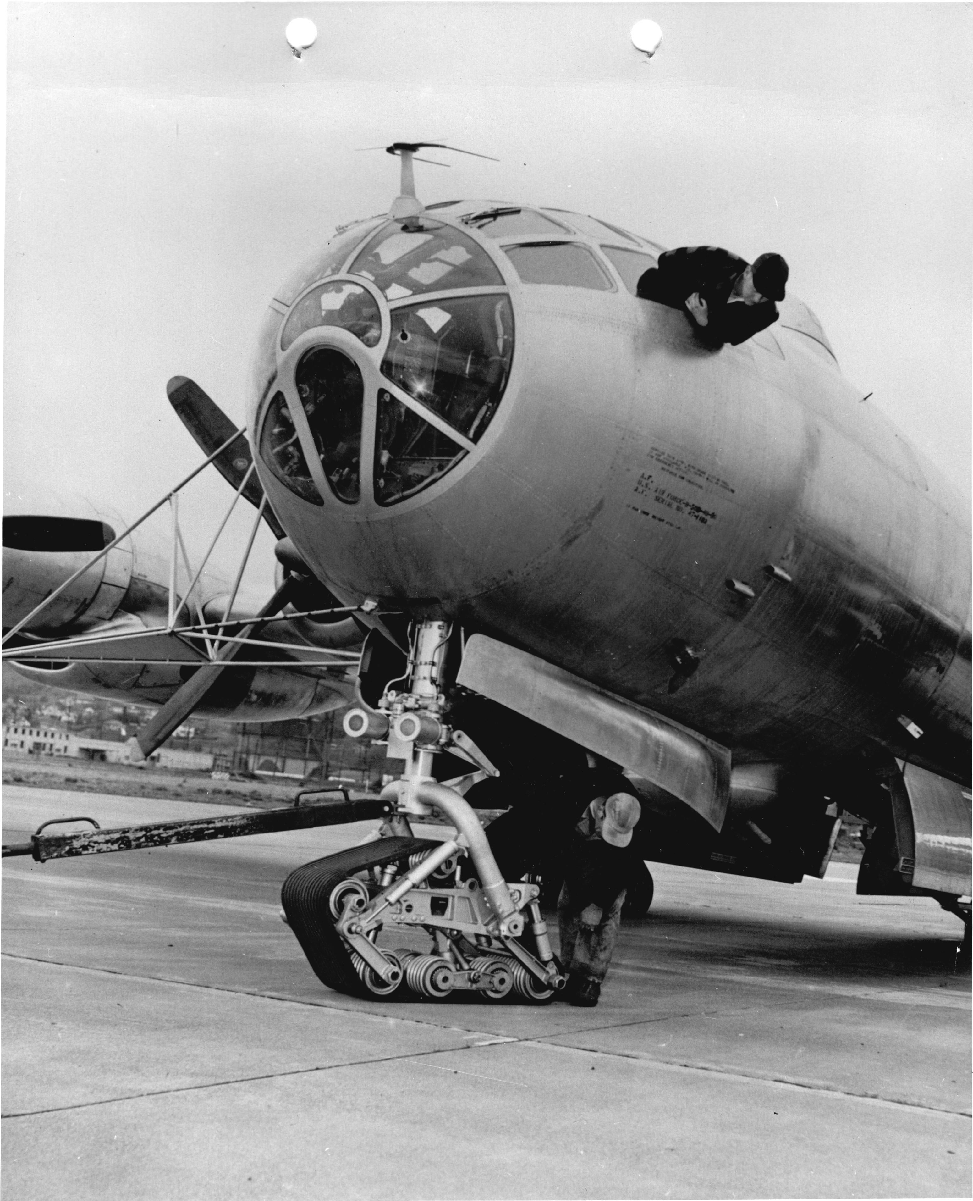 A Boeing B-50 parked on an airfield apron with track landing gear.