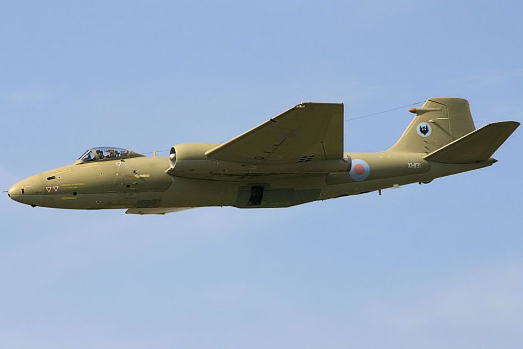 An English Electirc Canberra flying in the sky.