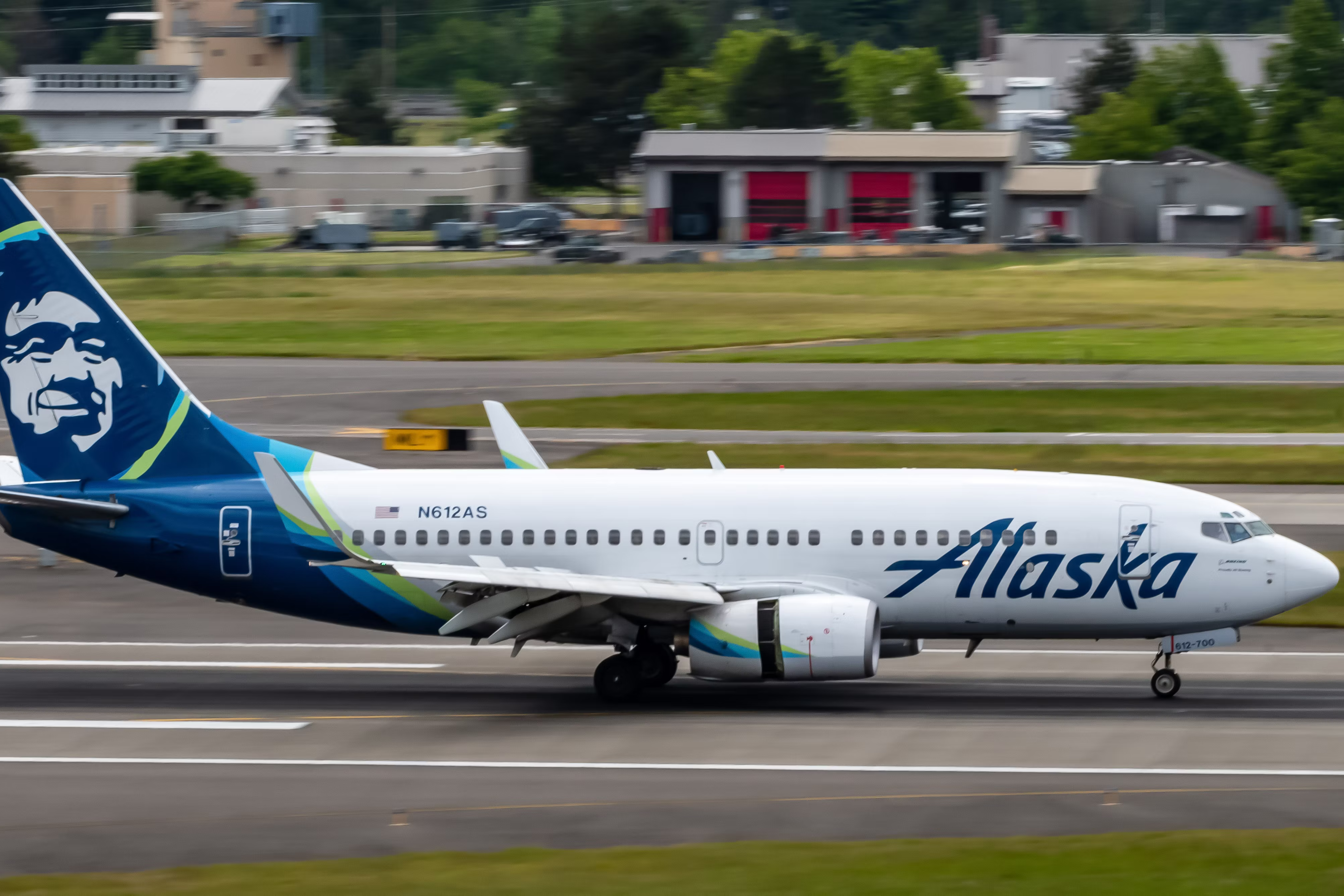 An Alaska Airlines Boeing 737-700 on an airport apron.
