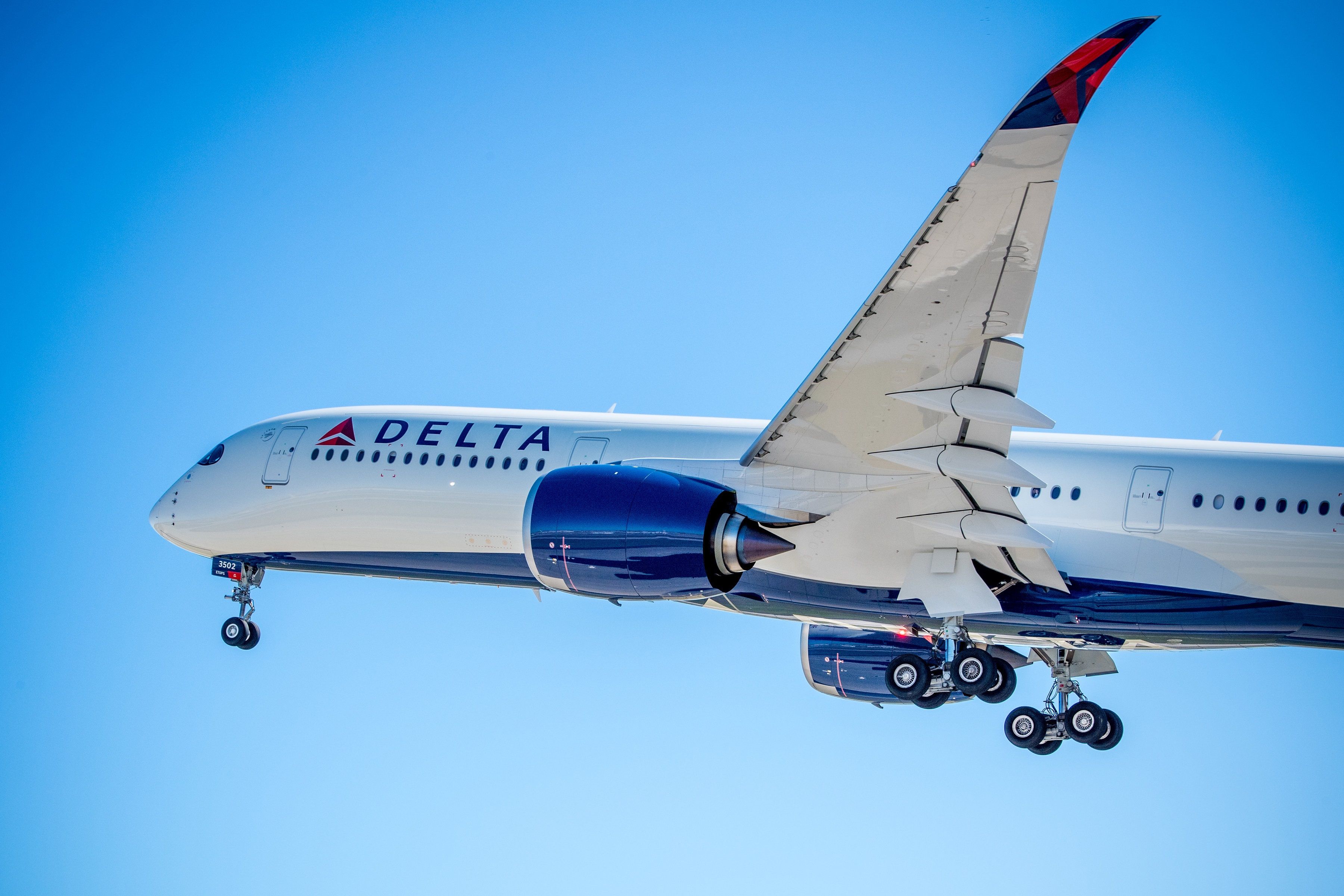 A Delta Airbus A350 flying in the sky.