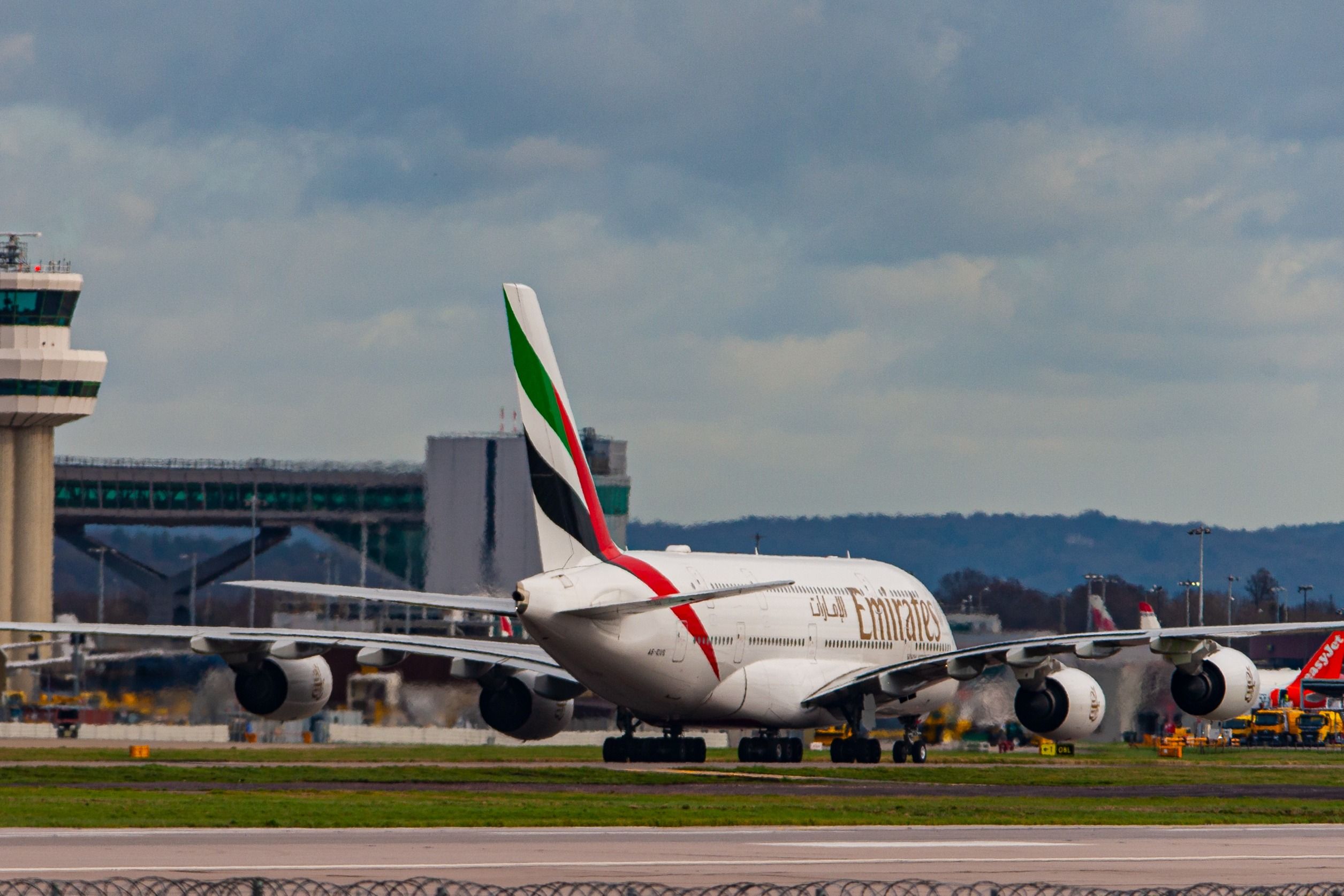 An Emirates Airbus A380 on an airport apron.