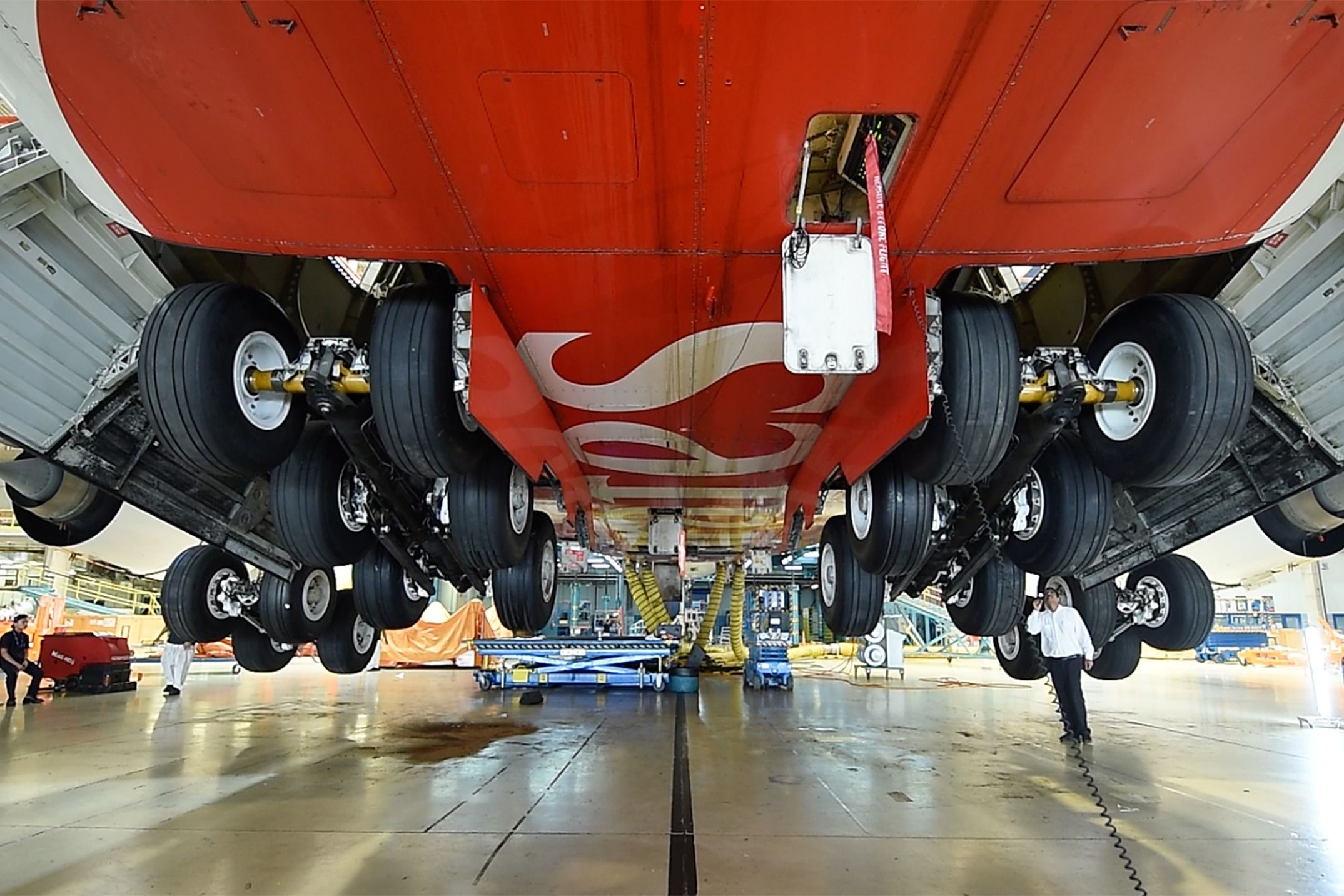 A closeup of the landing gear of an Emirates Airbus A380.