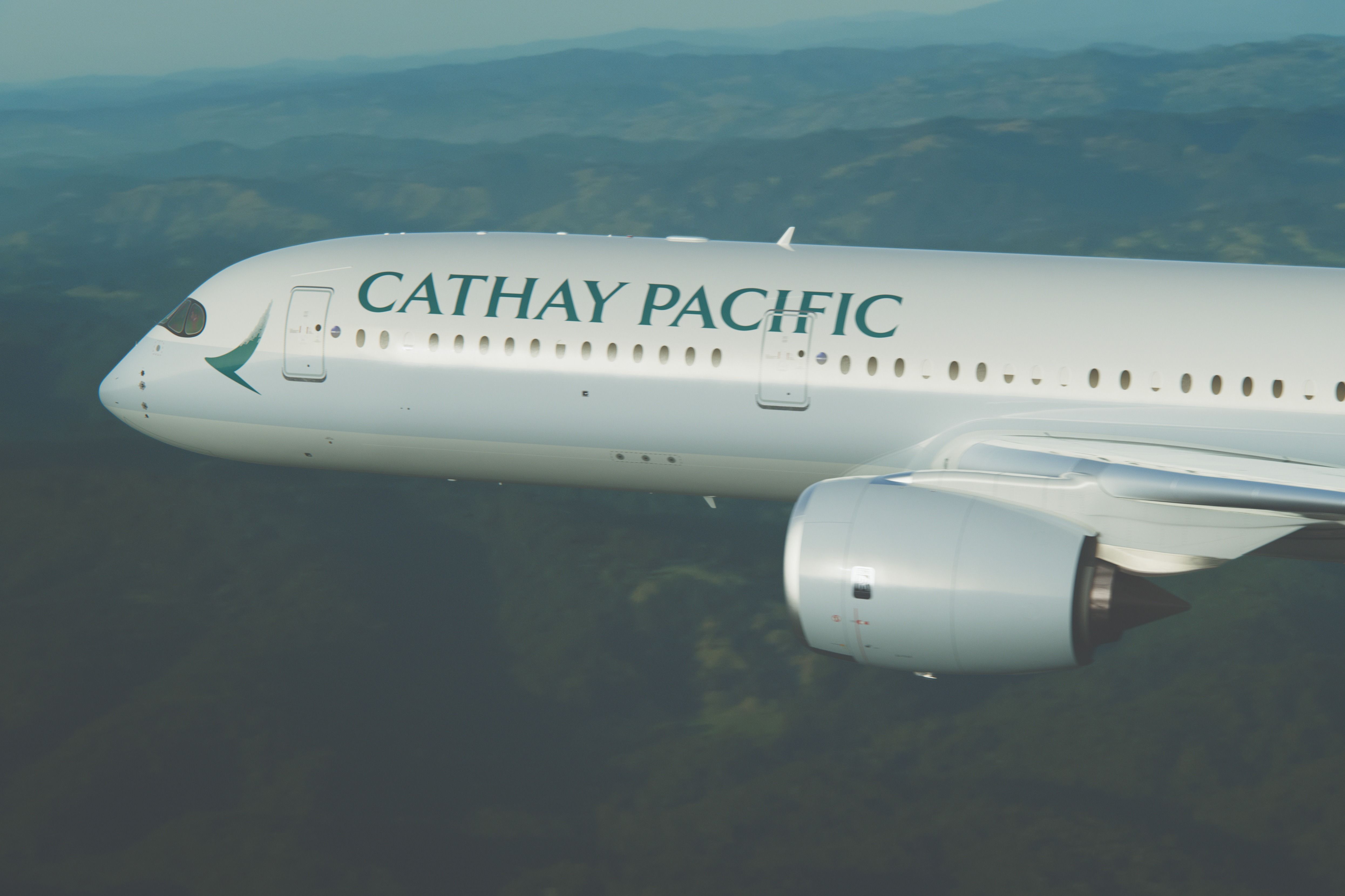 A Cathay Pacific Airbus A350 flying over Hong Kong