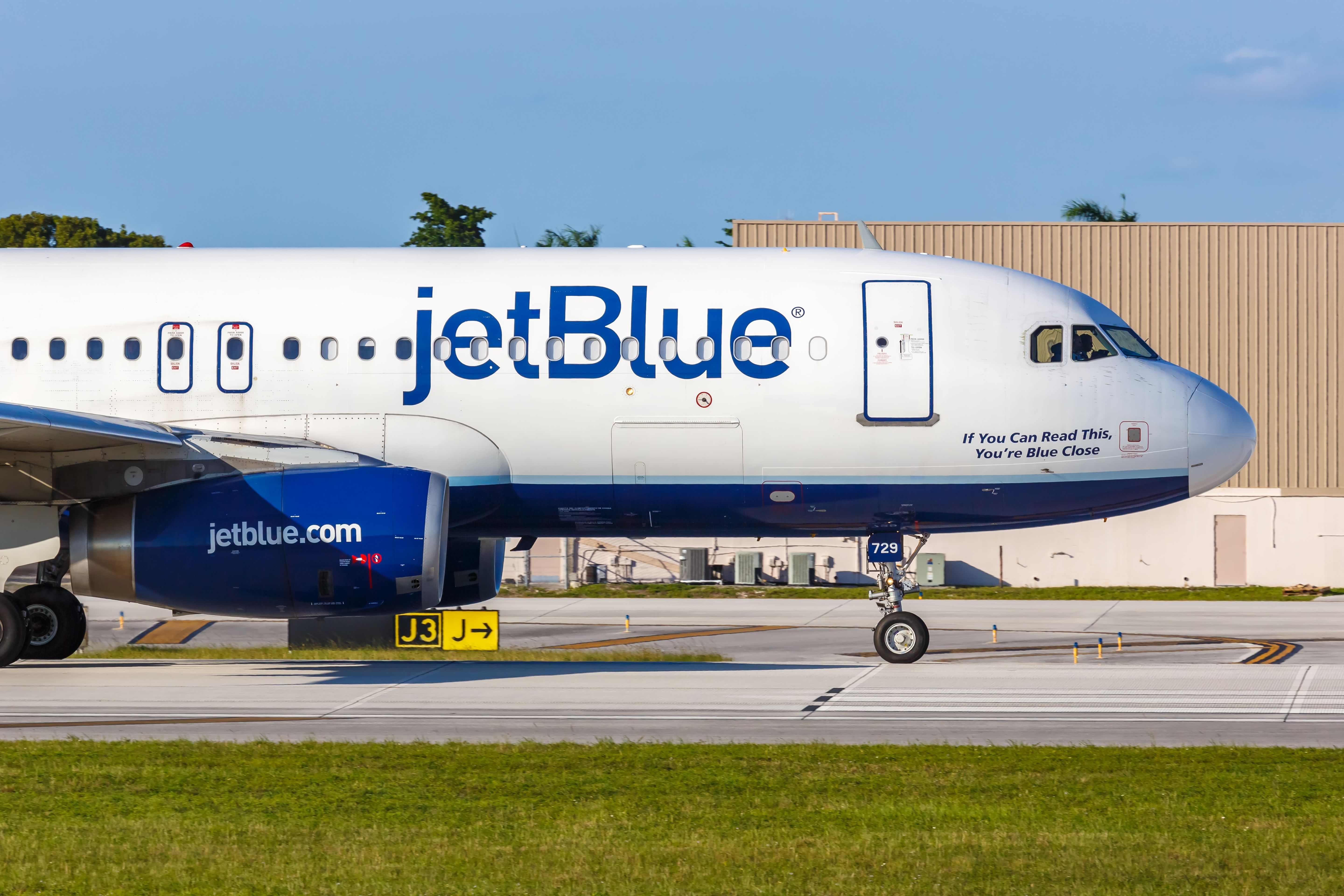 A JetBlue Airbus A320 on an airport apron.