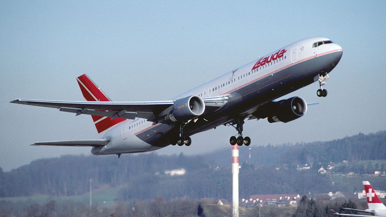 A Lauda Air Boeing 767-300 flying in the sky.