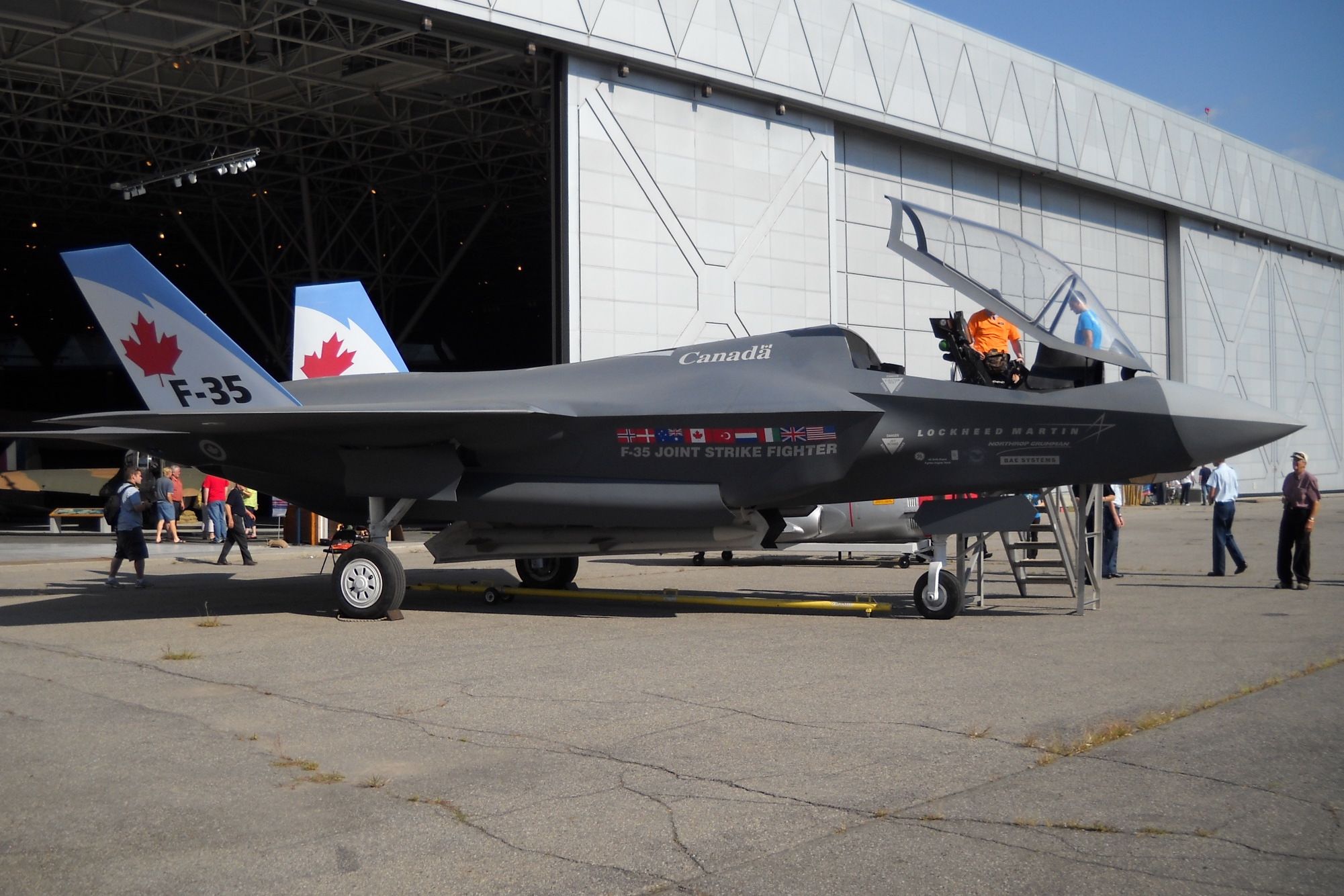 A RCAF F-35 Lightning II parked outside a hangar.