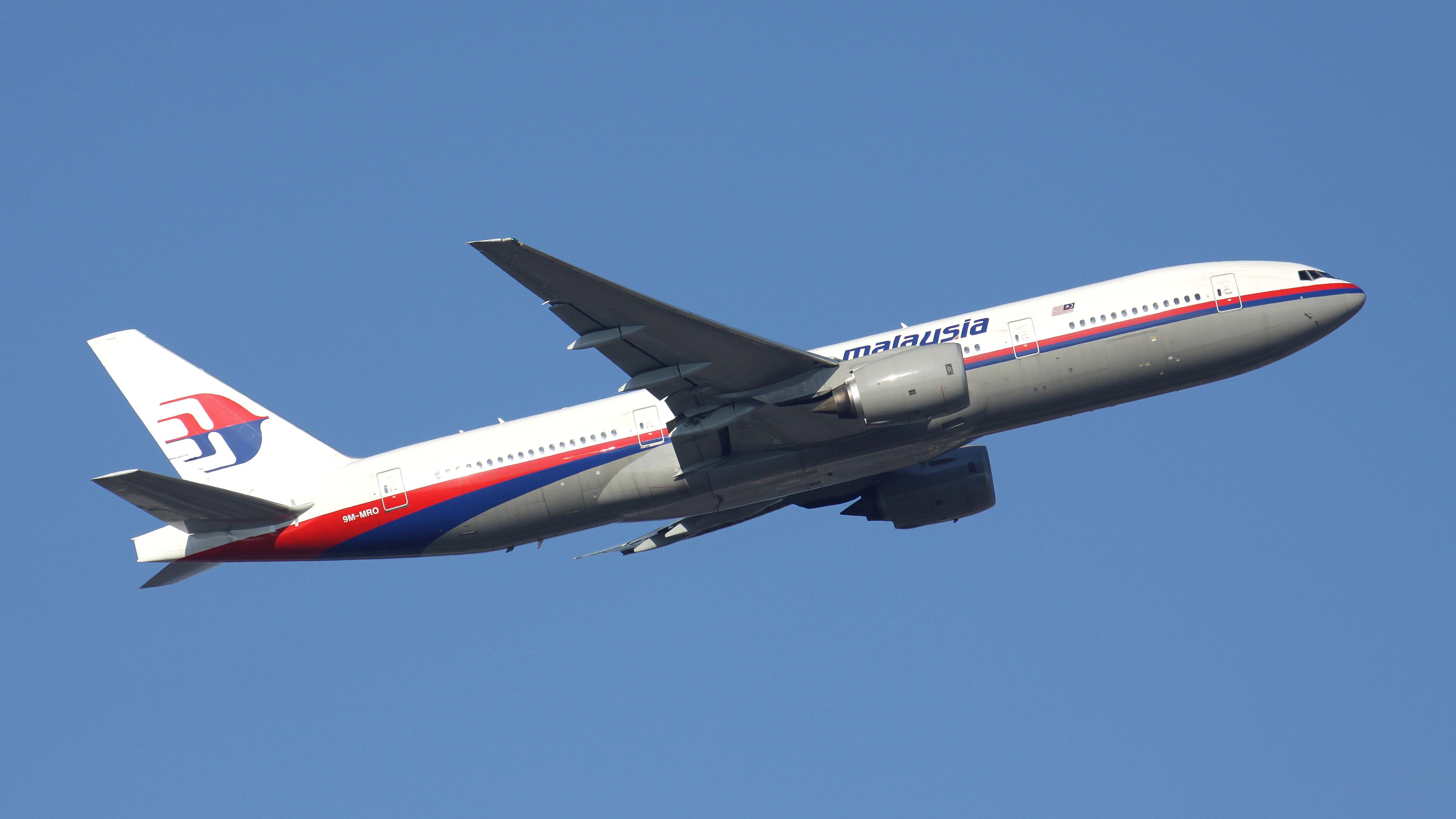 A Malaysia Airlines Boeing 777 Flying in the sky.