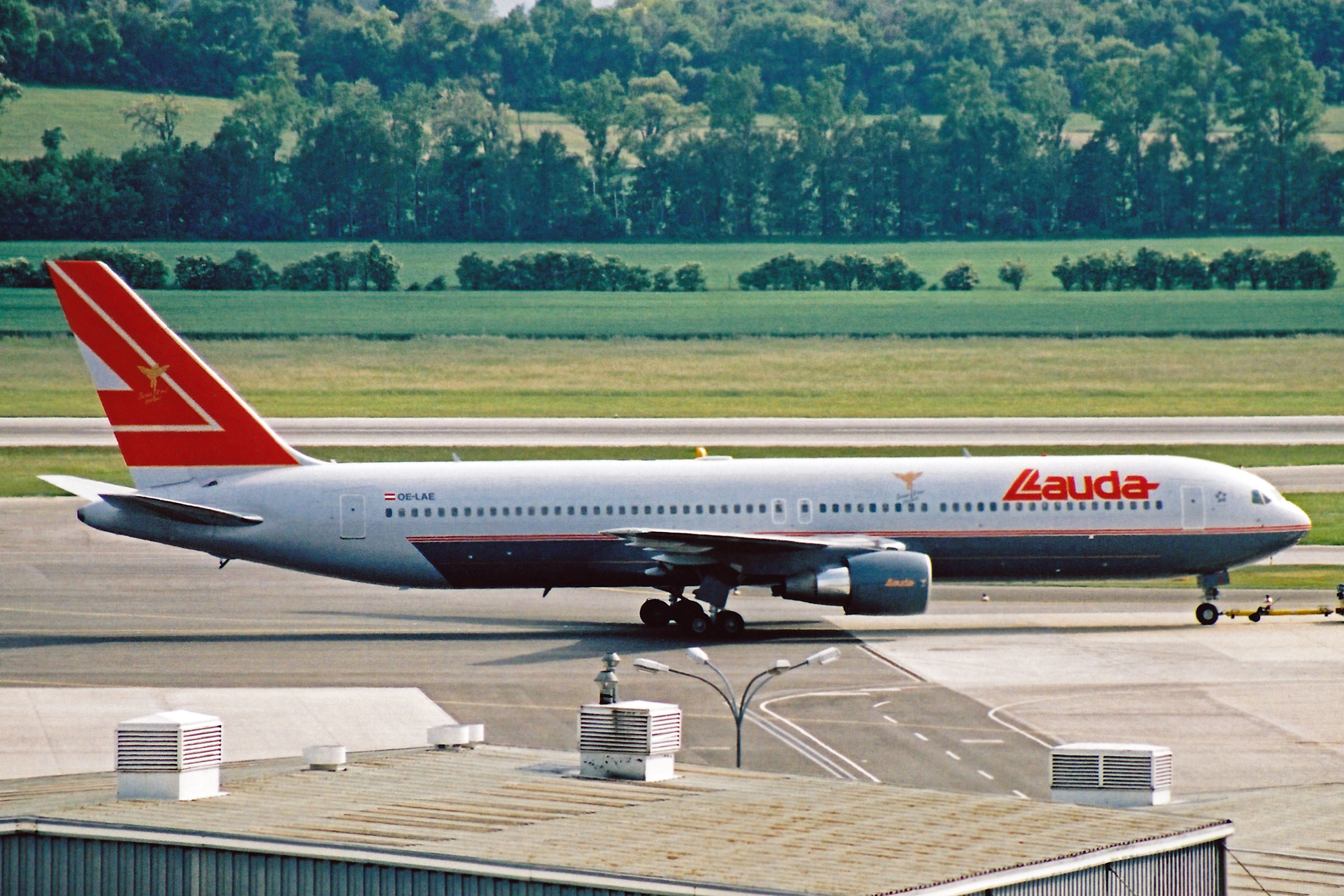 A Lauda Air Boeing 767 on an airport apron.