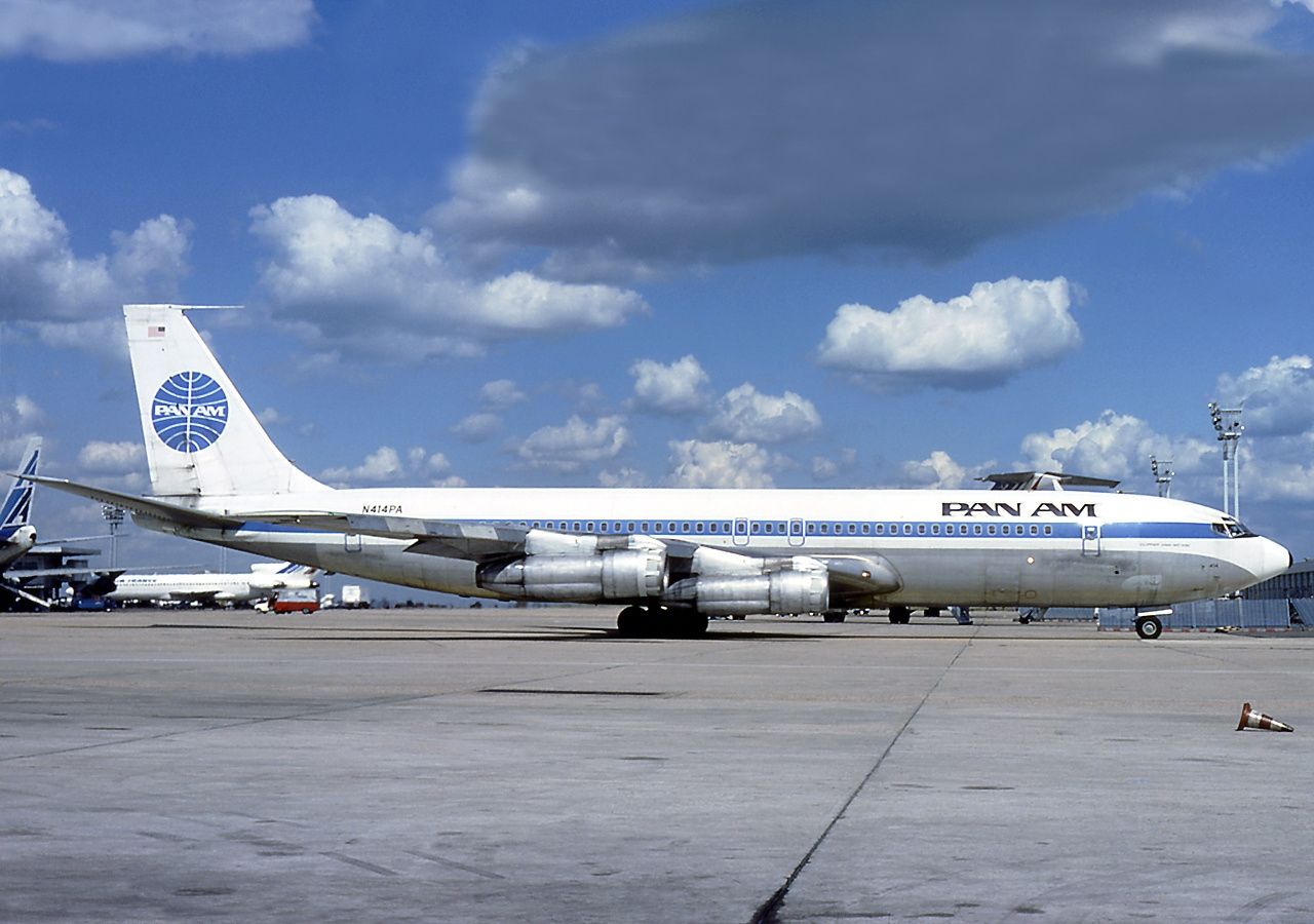A Pan Am Boeing 707 on an airport apron.