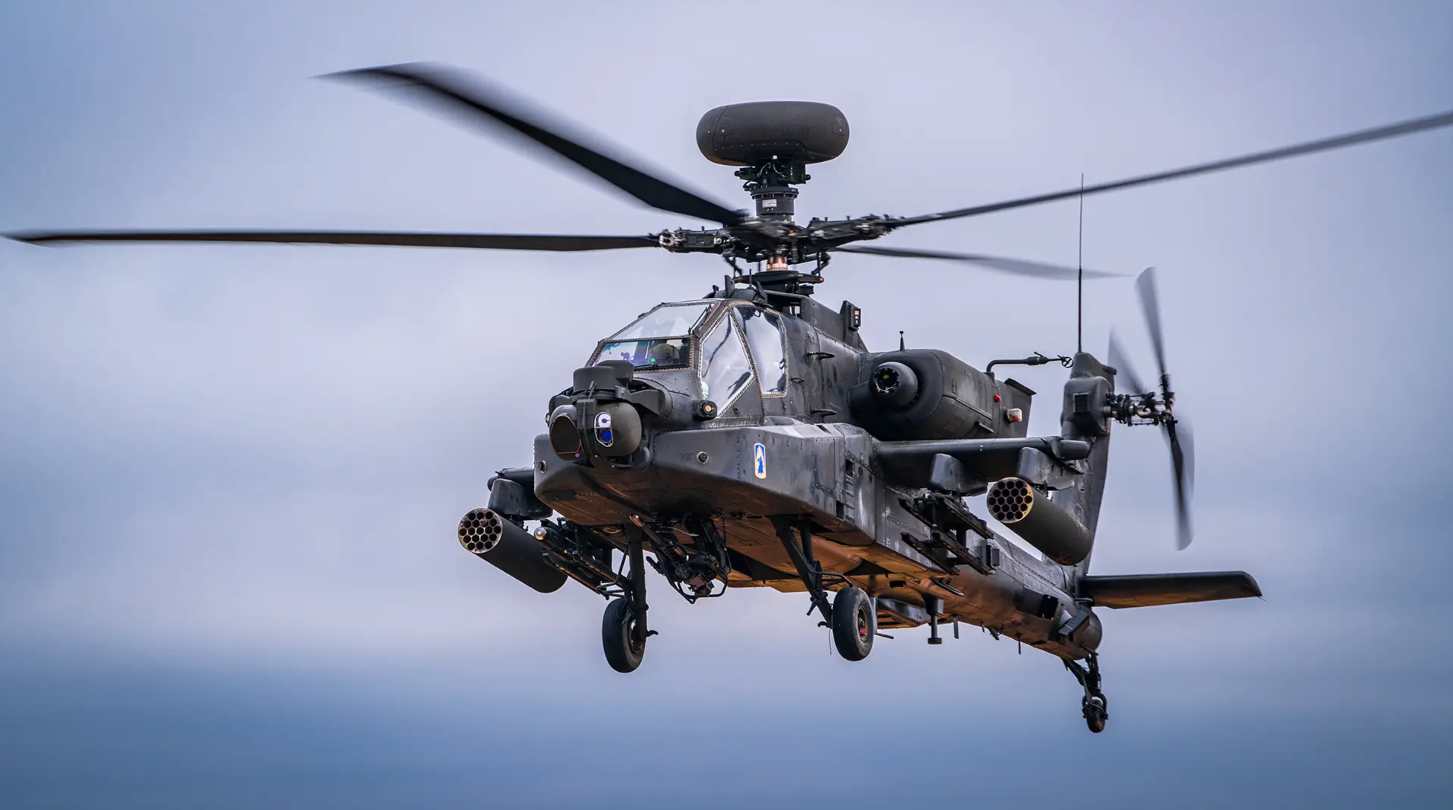     A US Army Boeing AH-64 Apache helicopter takes off.