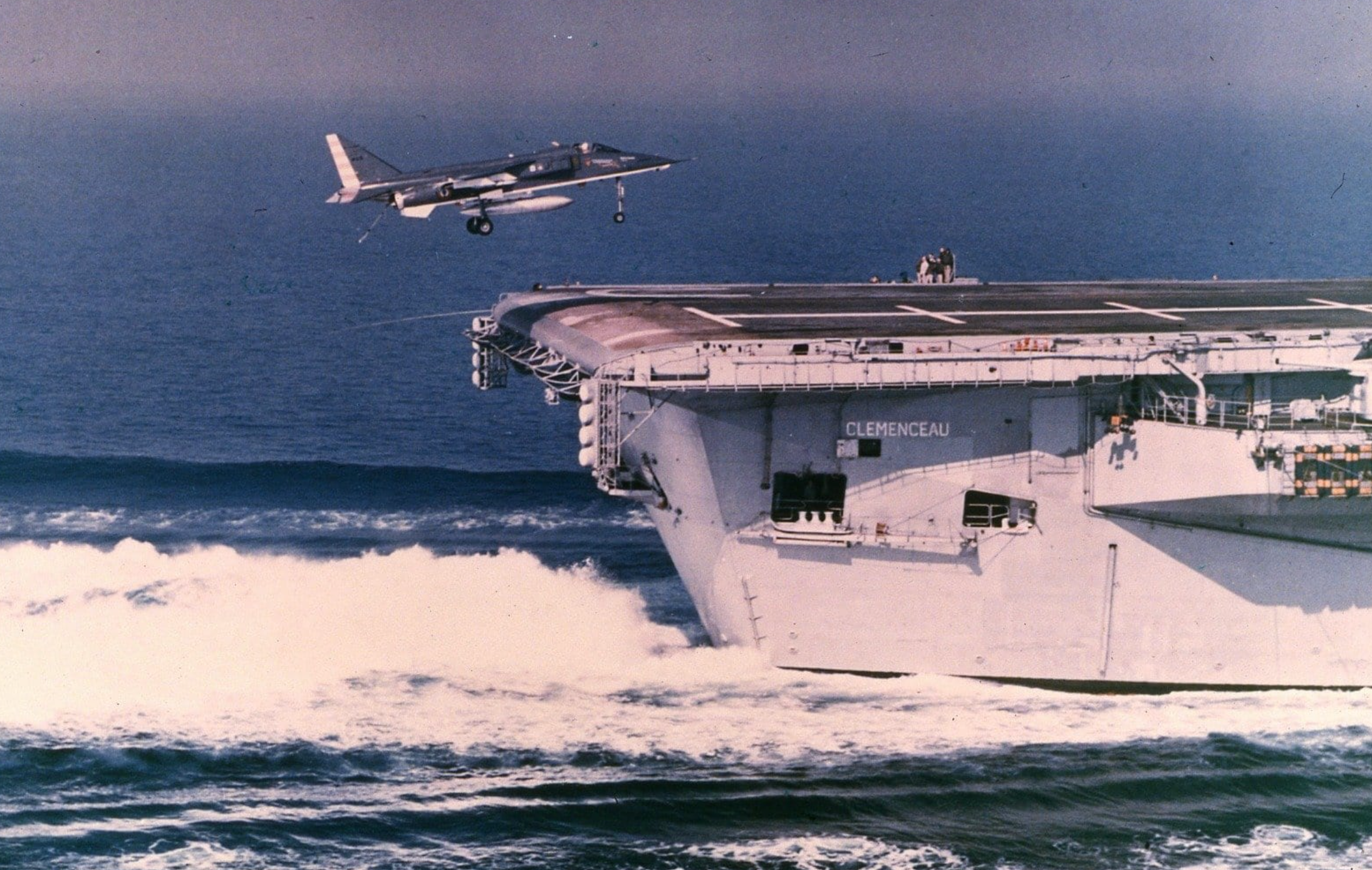 A French Air Force SEPECAT Jaguar Attack landing on an aircraft carrier.