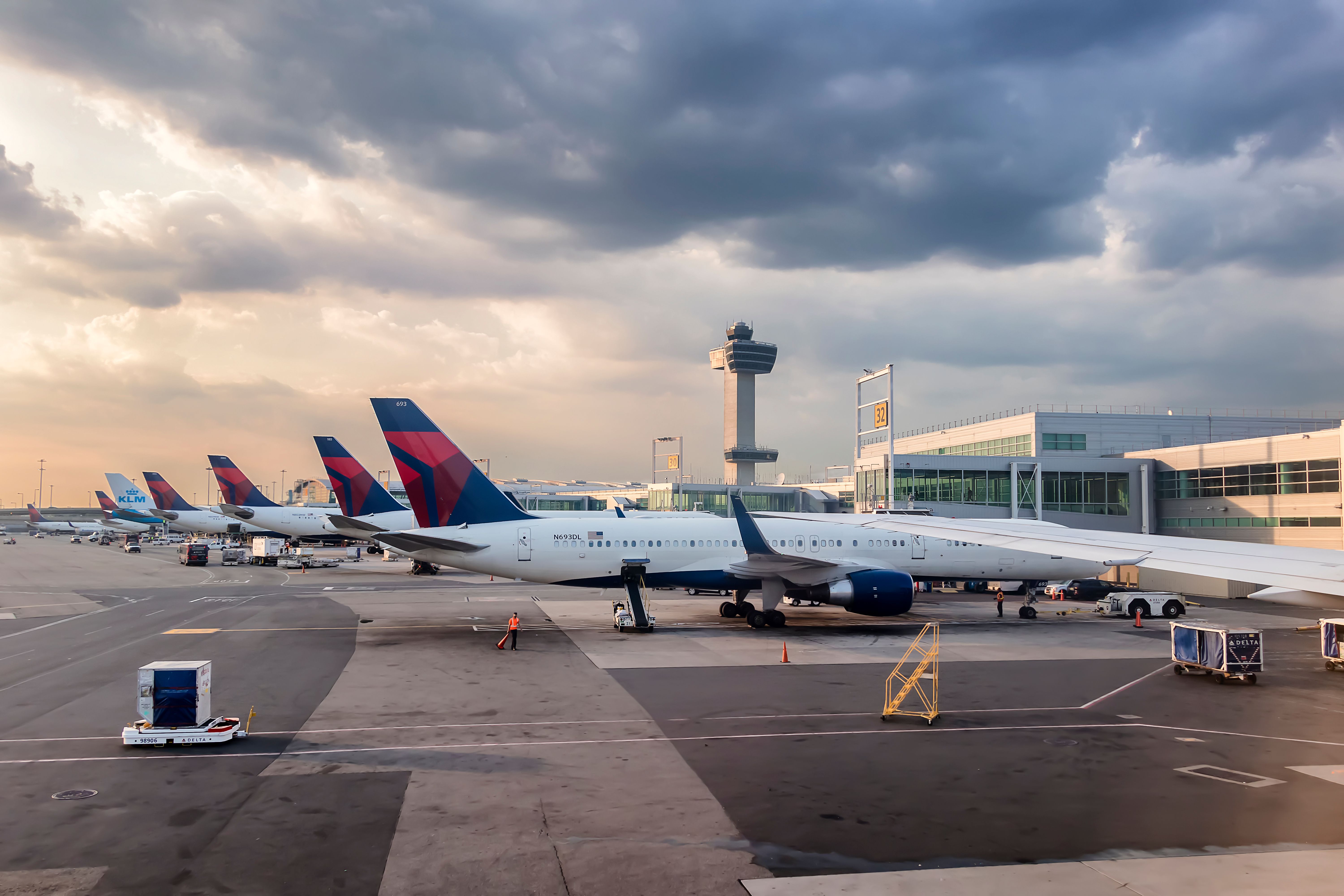 Several Delta Air Lines planes are parked at New York’s JFK airport.