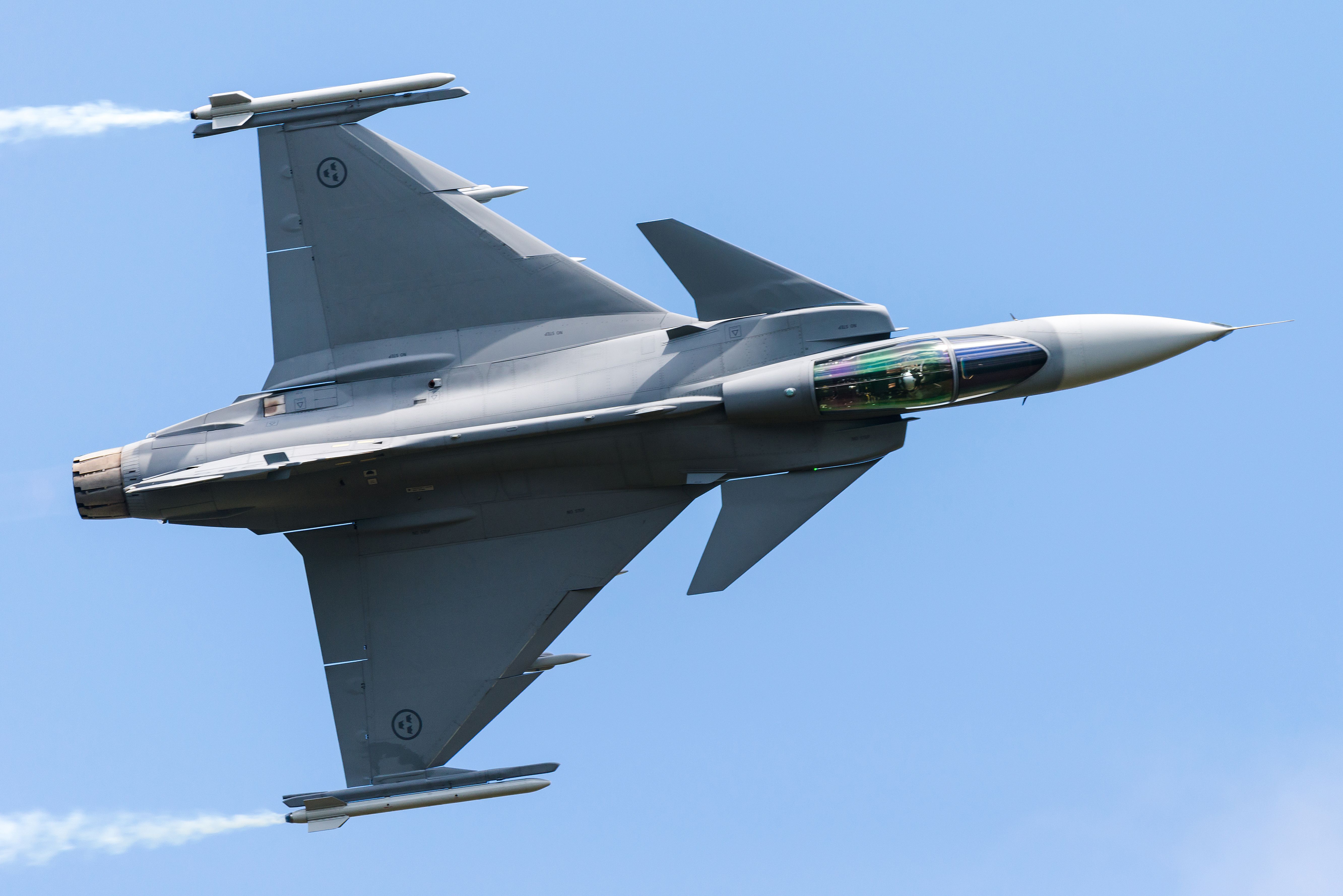 A Swedish Saab JAS39 Gripen fighter jet giving a demonstration at the Belgian Air Force Days