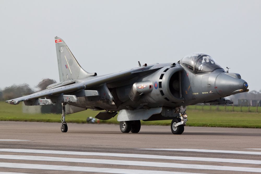 An RAF Harrier Jump Jet on an airport apron.