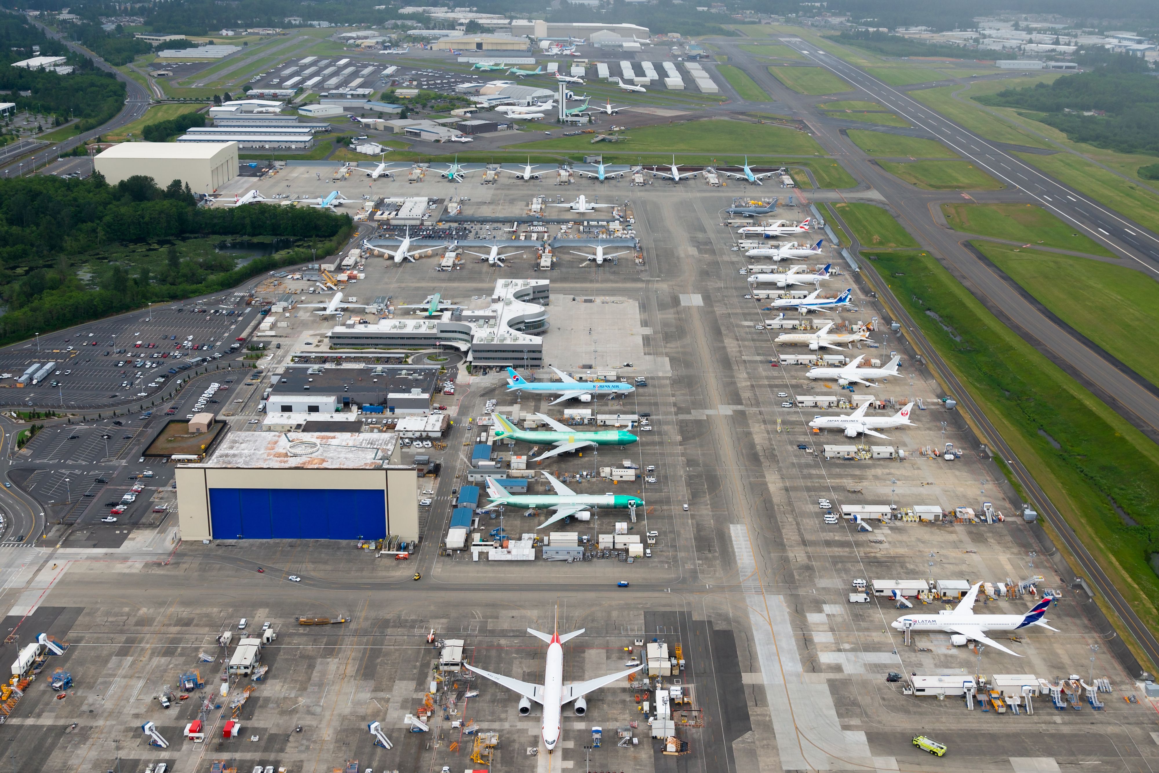 Aerial overview of Boeing factory, ramp, and hangars at Paine Field.