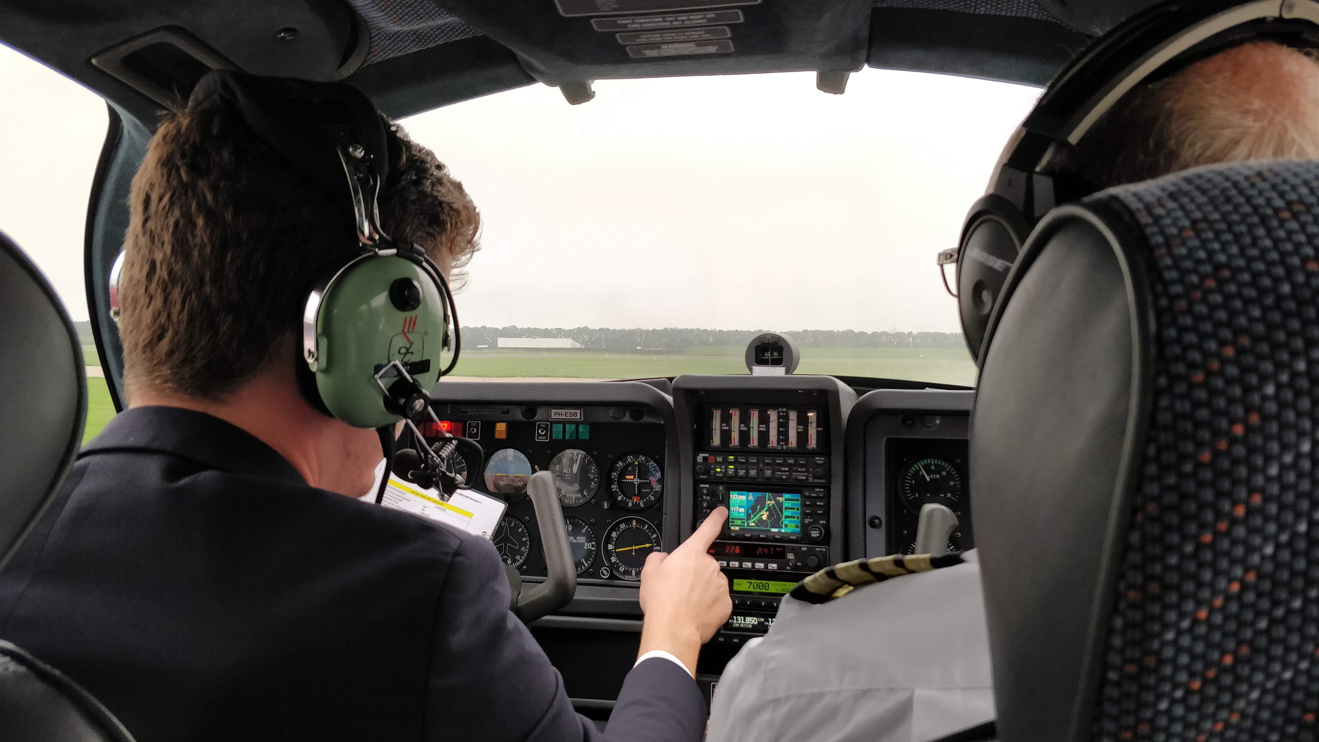 A student pilot with their instructor. 