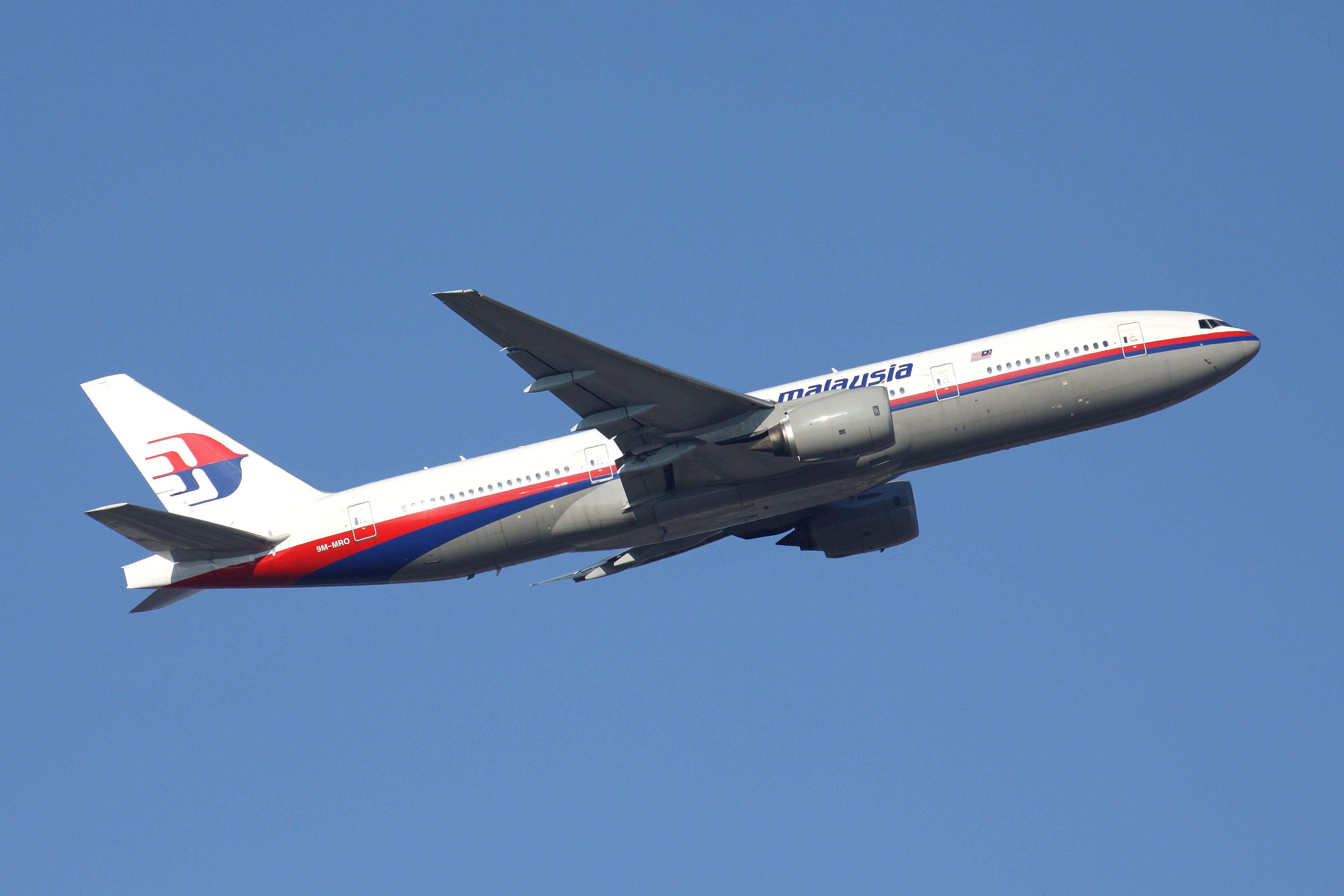 A Malaysia Airlines Boeing 777 Flying in the sky.