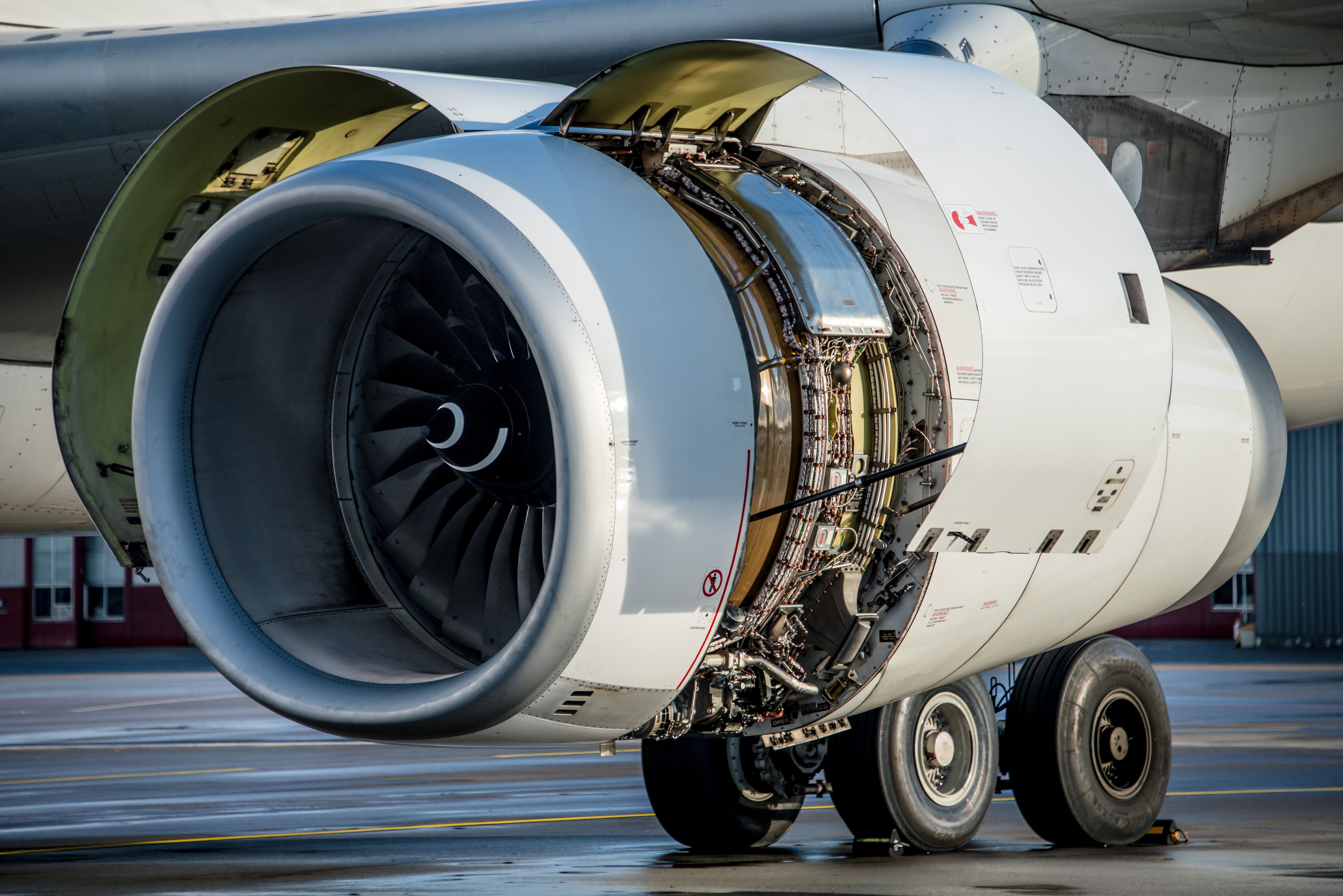 Airliner engine with open cowlings.