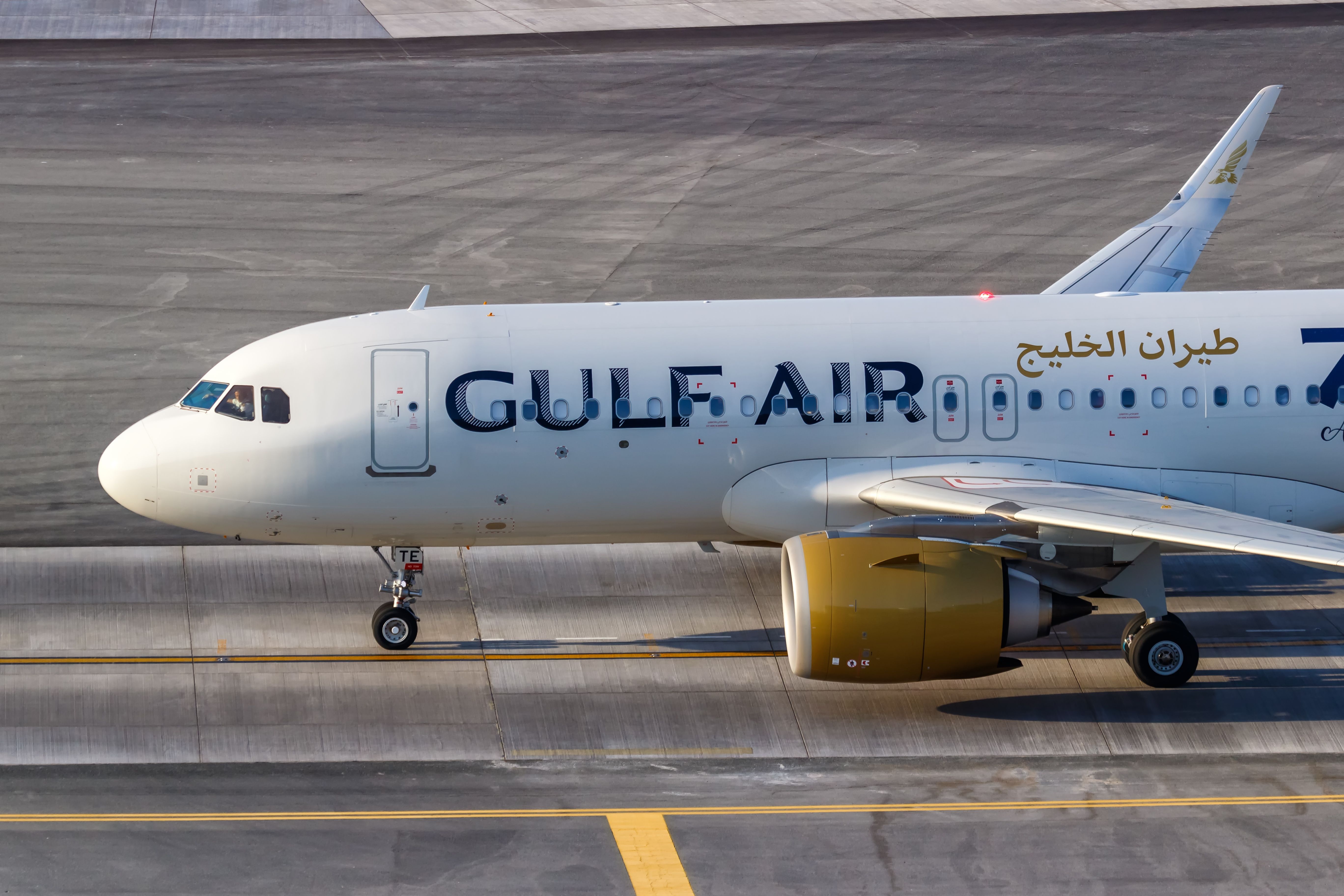 A Gulf Air Airbus A320neo on an airport apron.