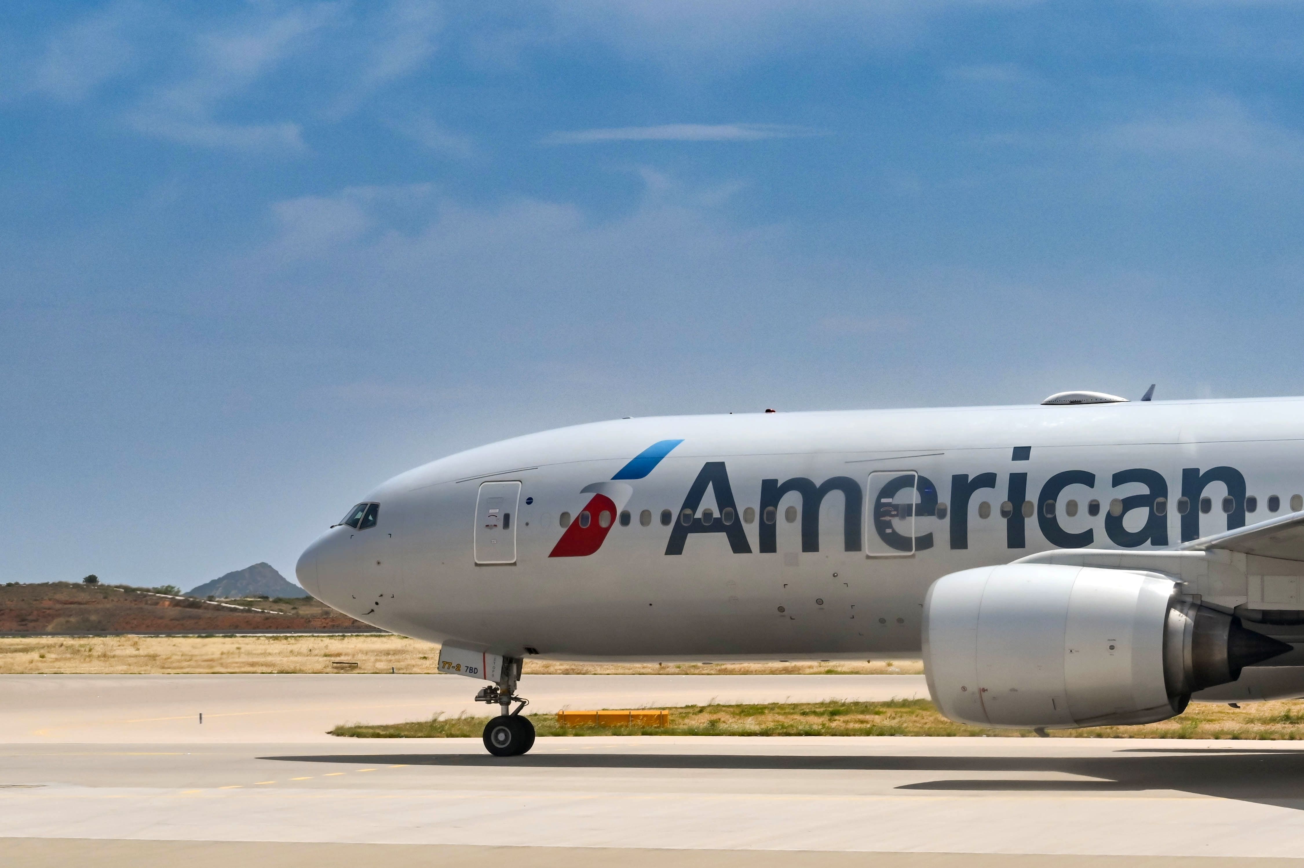An American Airlines Boeing 777-200ER on an airport apron.