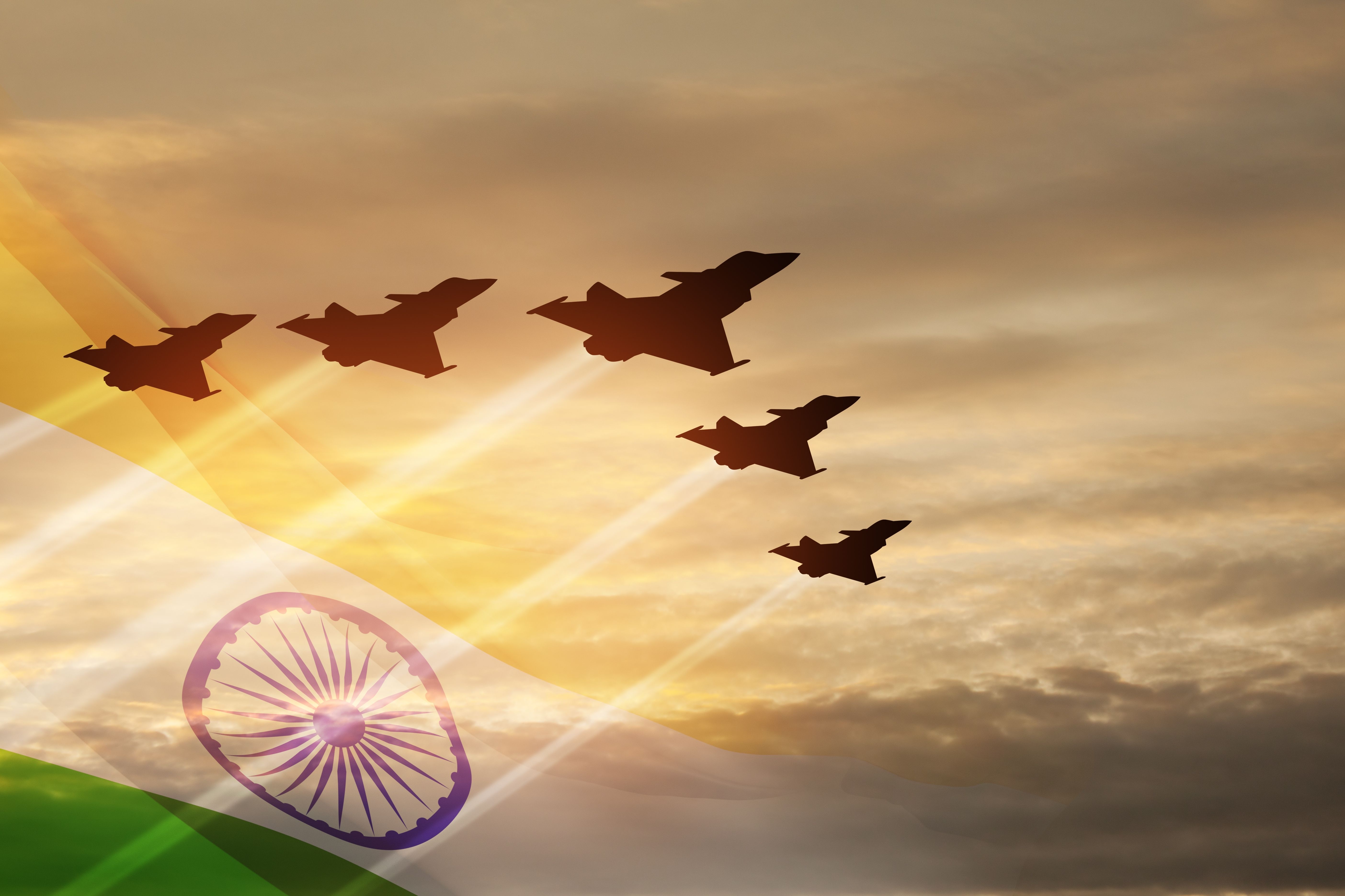 Indian jet air shows on background of sunset with transparent Indian flag.