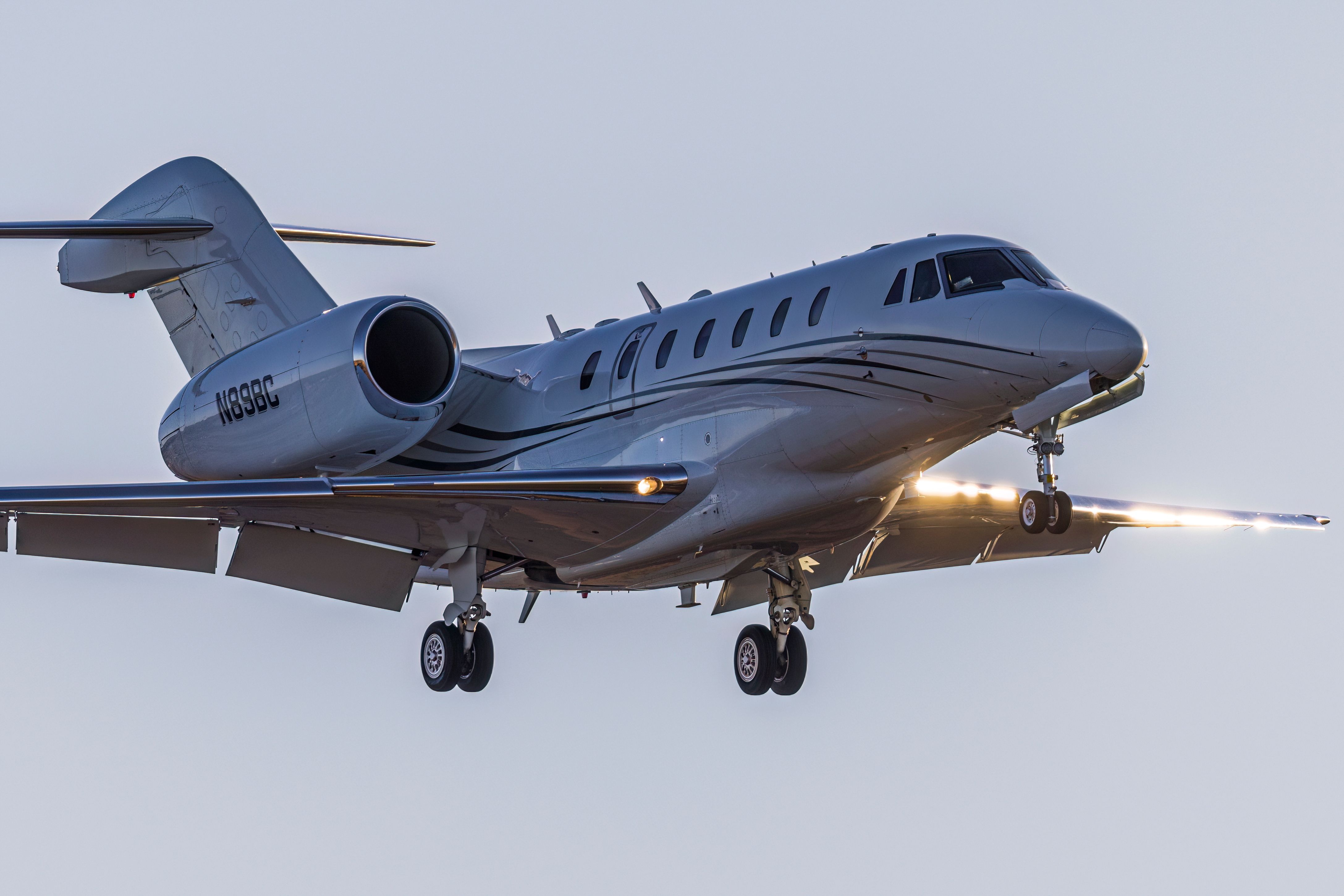 A Cessna Citation X comes in for a landing at Centennial Airport at sunset