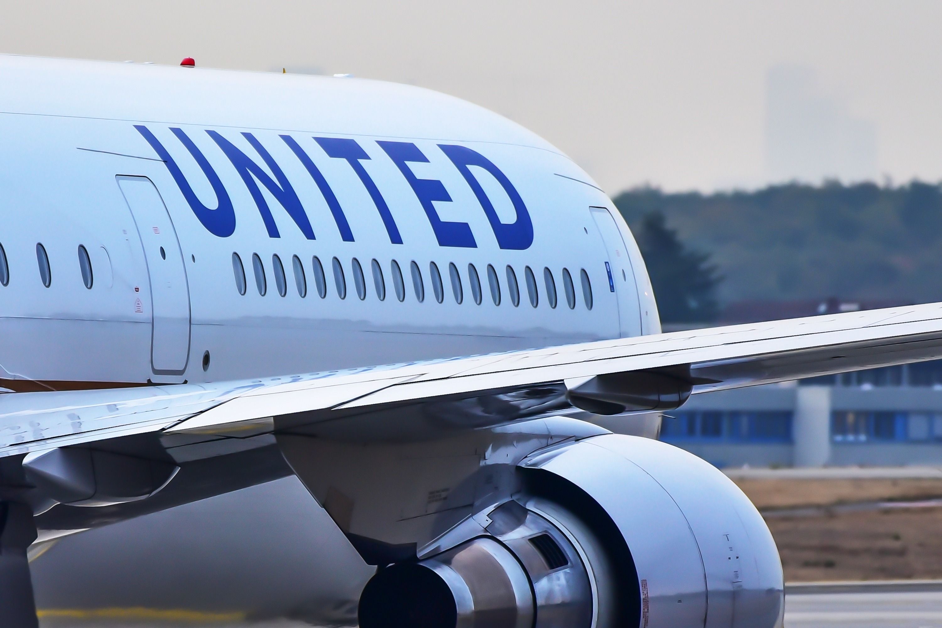 A closeup of a United Airlines Boeing 767 on an airport apron.