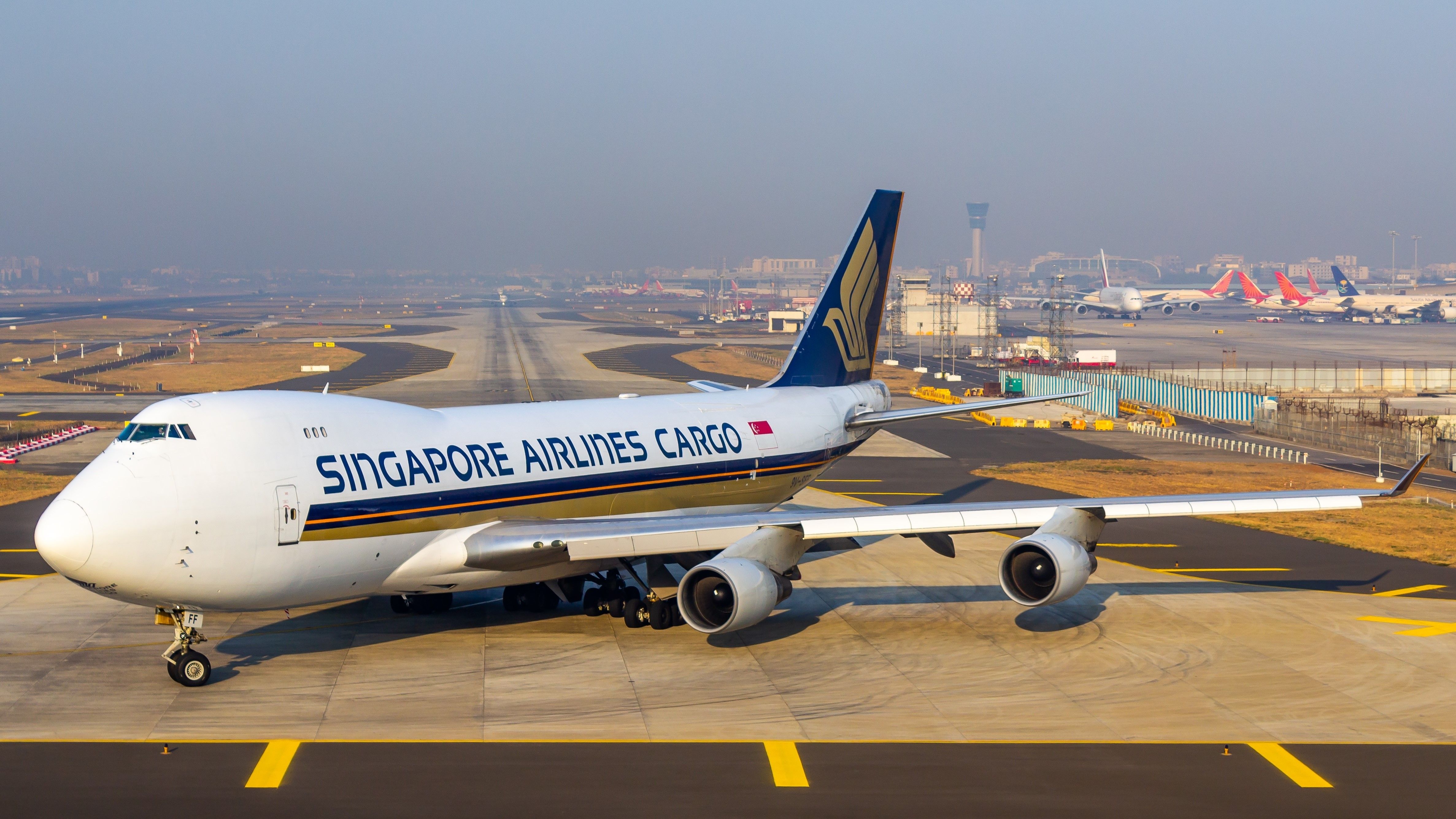 A Singapore Airlines Cargo Boeing 747-400F on an airport apron.
