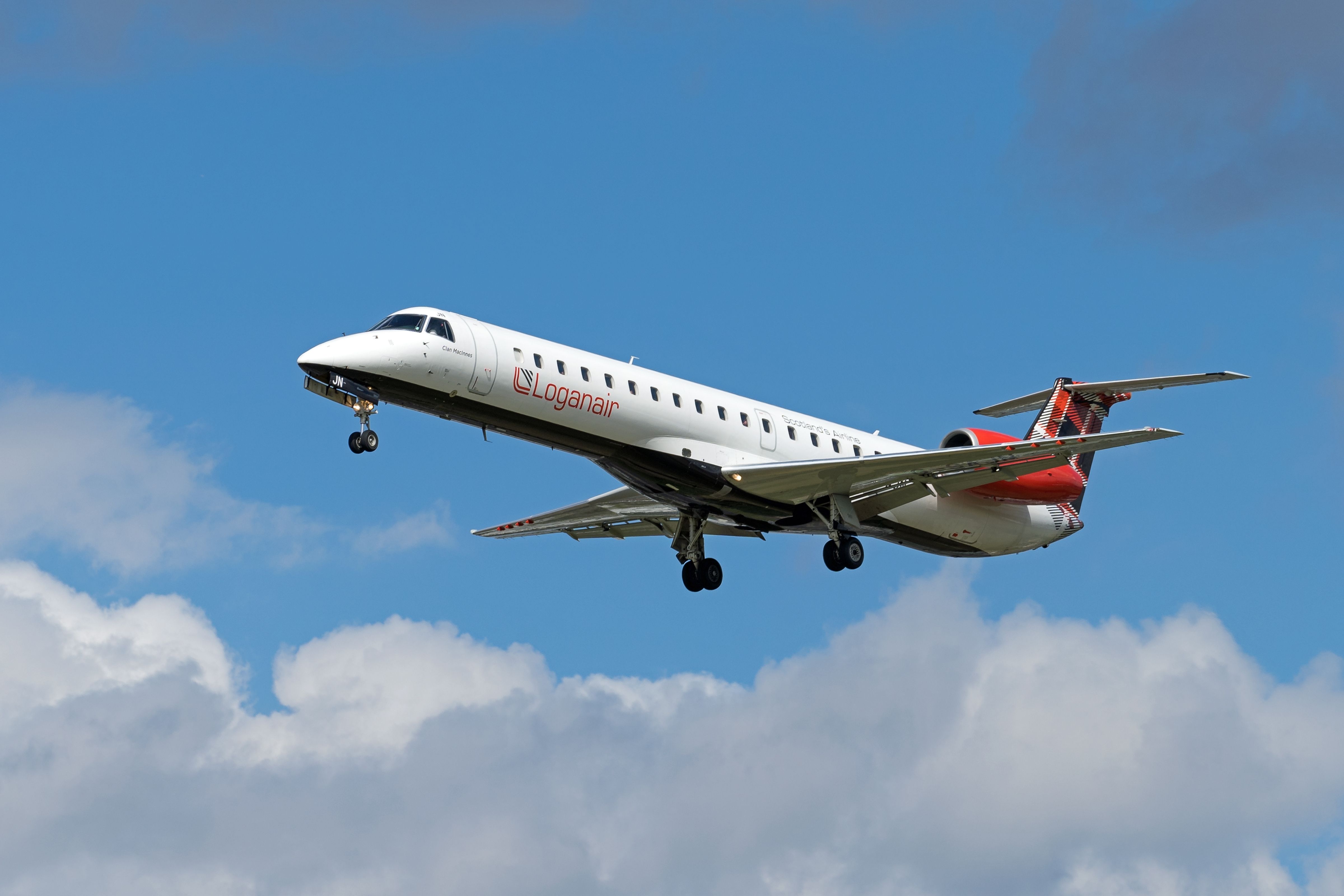 A Loganair Embraer ERJ145 Flying in the sky.