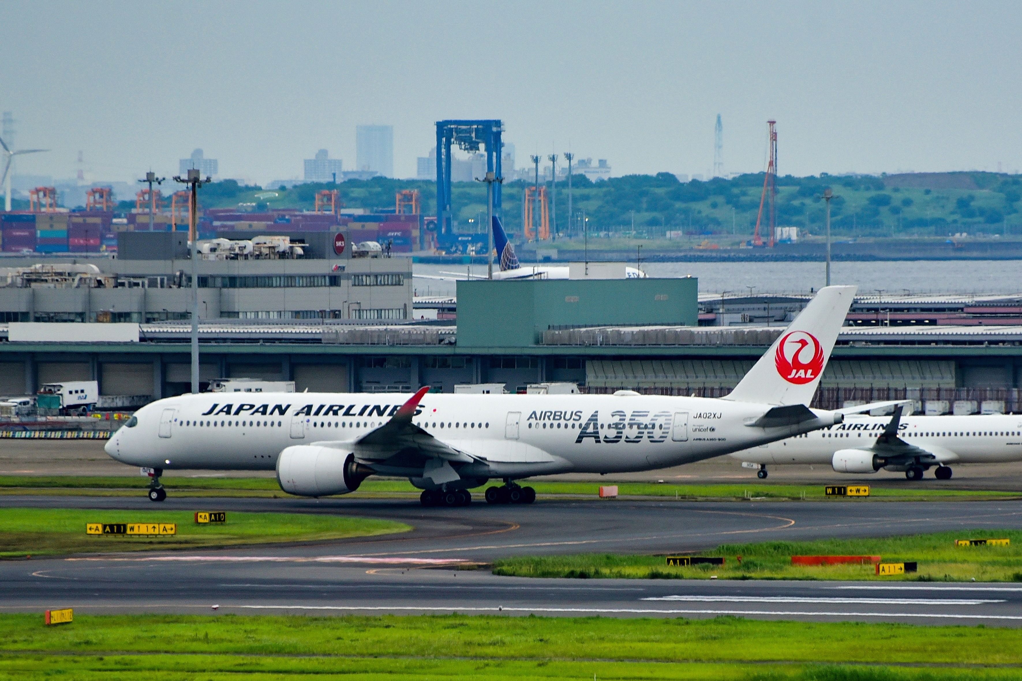 Japan Airlines Airbus A350 aircraft taxiing at Haneda Airport.