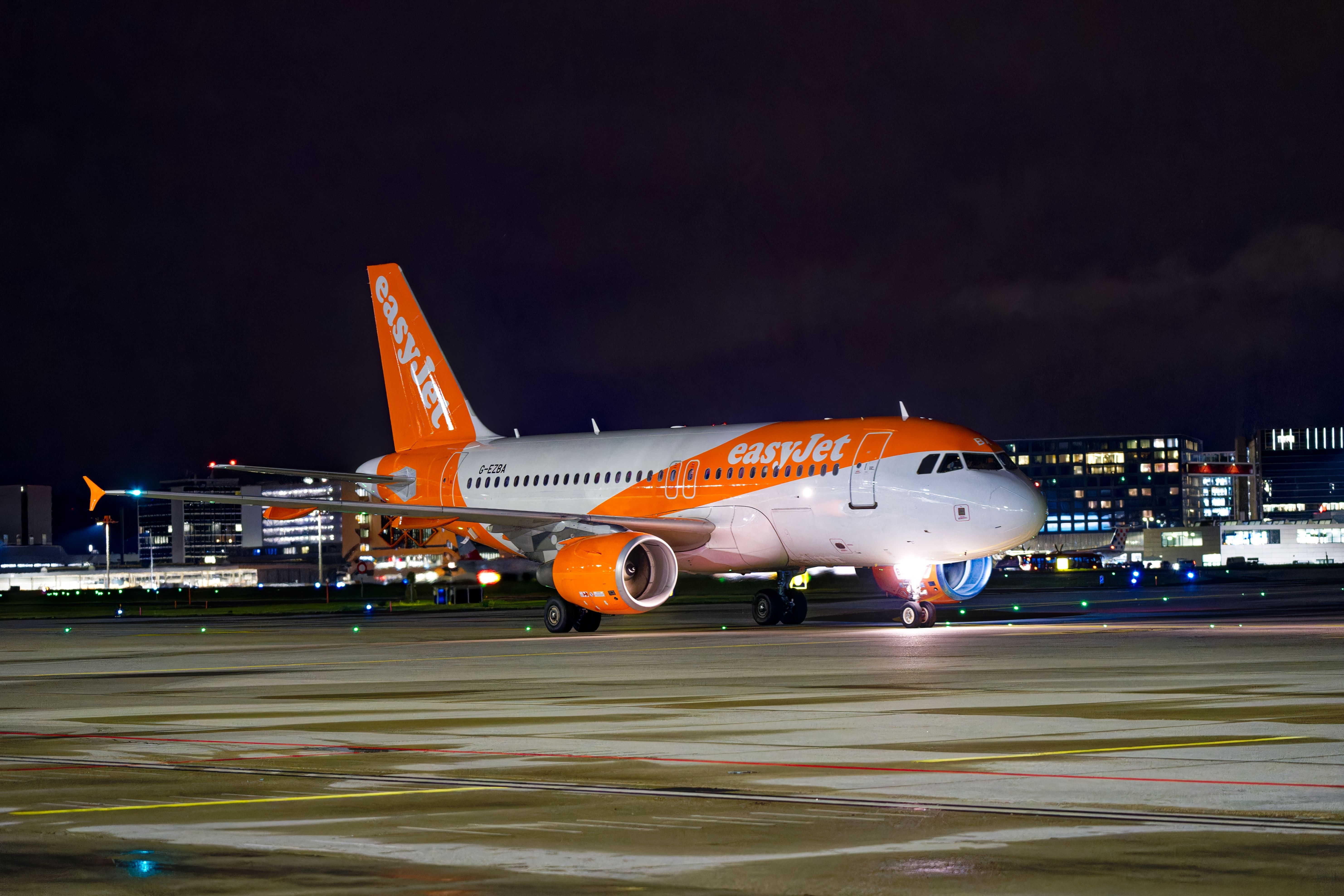 An easyJet Airbus A319 on an airport apron.