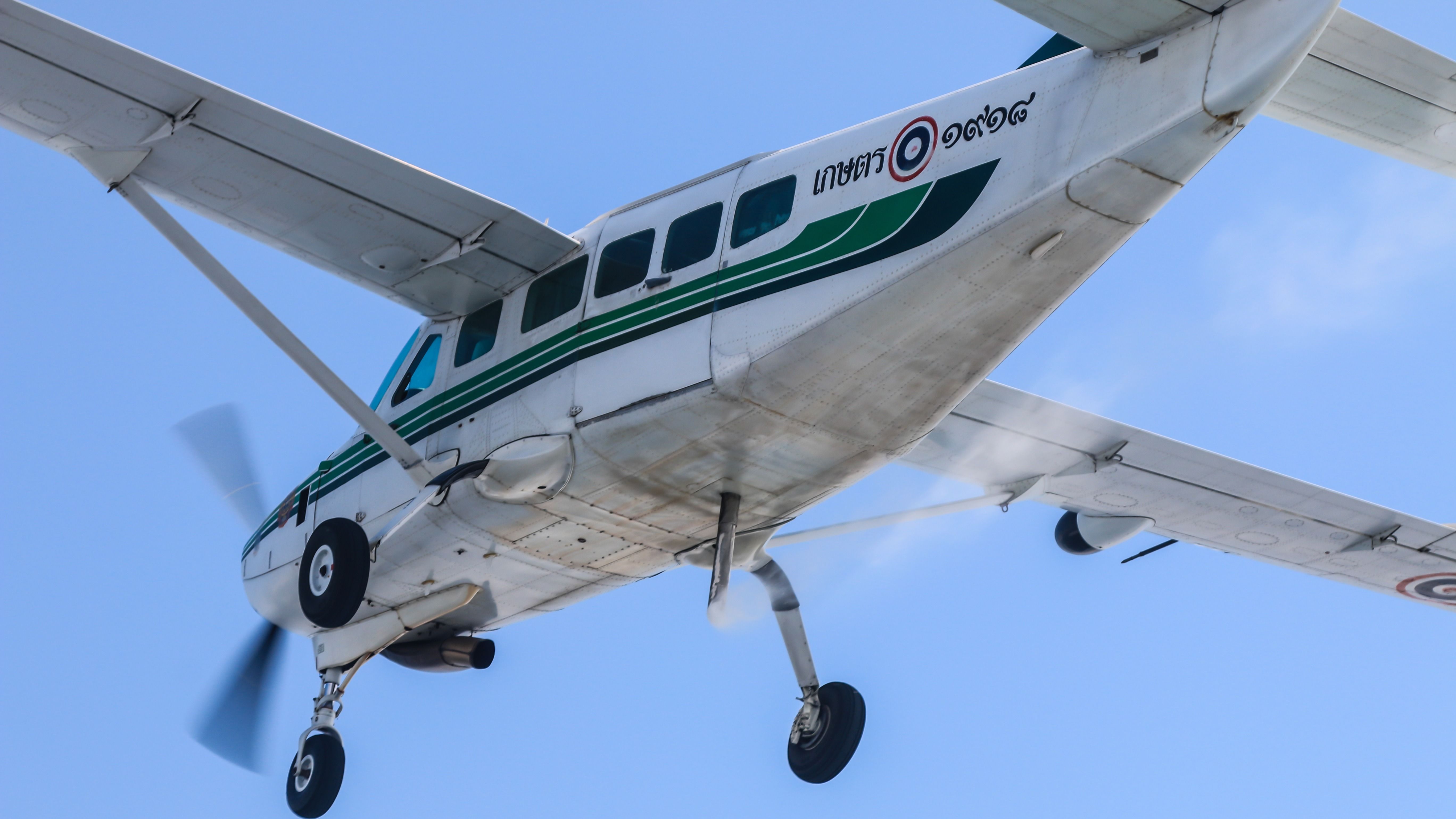 A closeup of a Cessna 208 Caravan Flying in the sky.