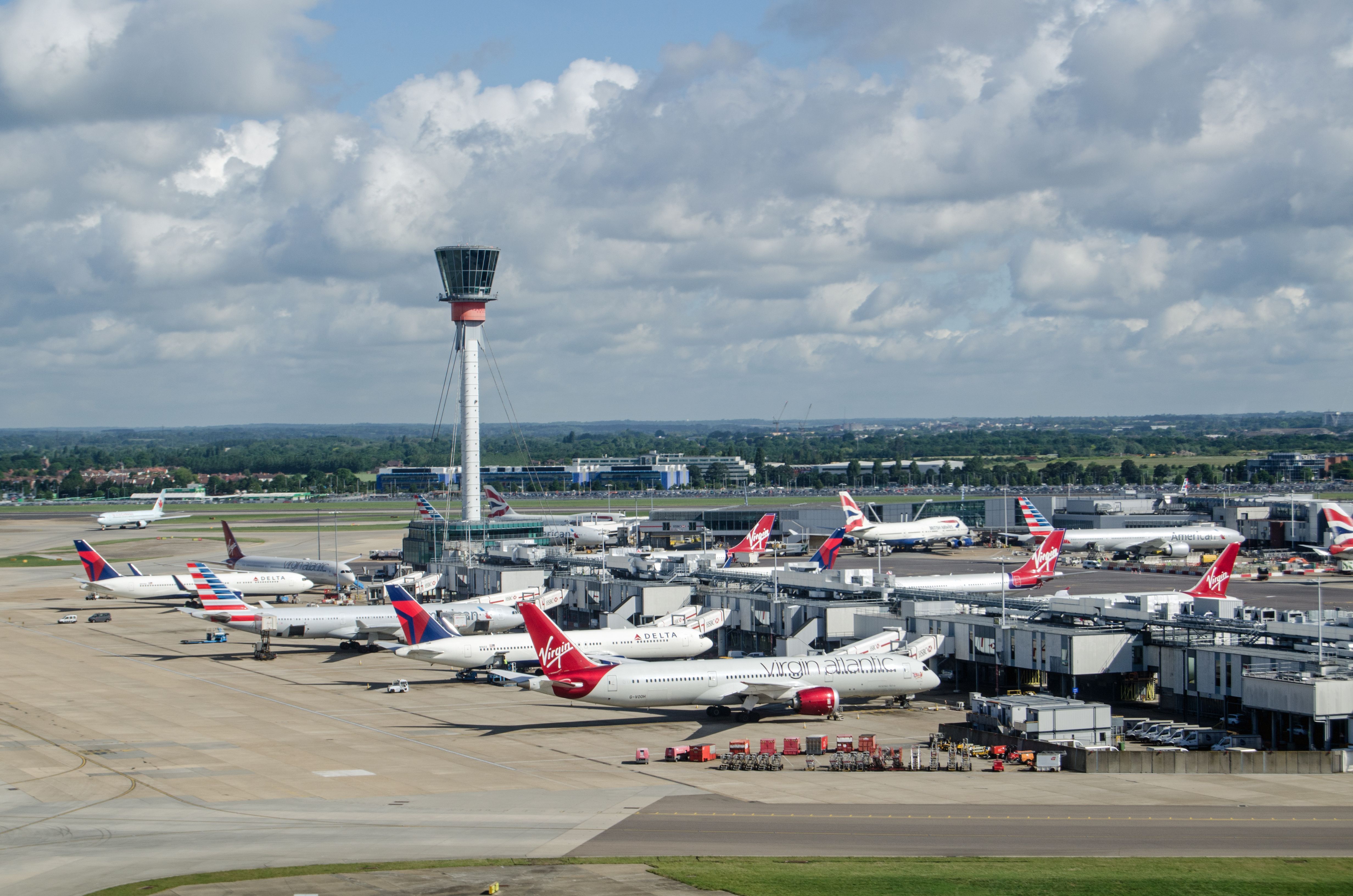 Several Virgin Atlantic and other aircraft parked at Terminal 3 of London's Heathrow Airport.