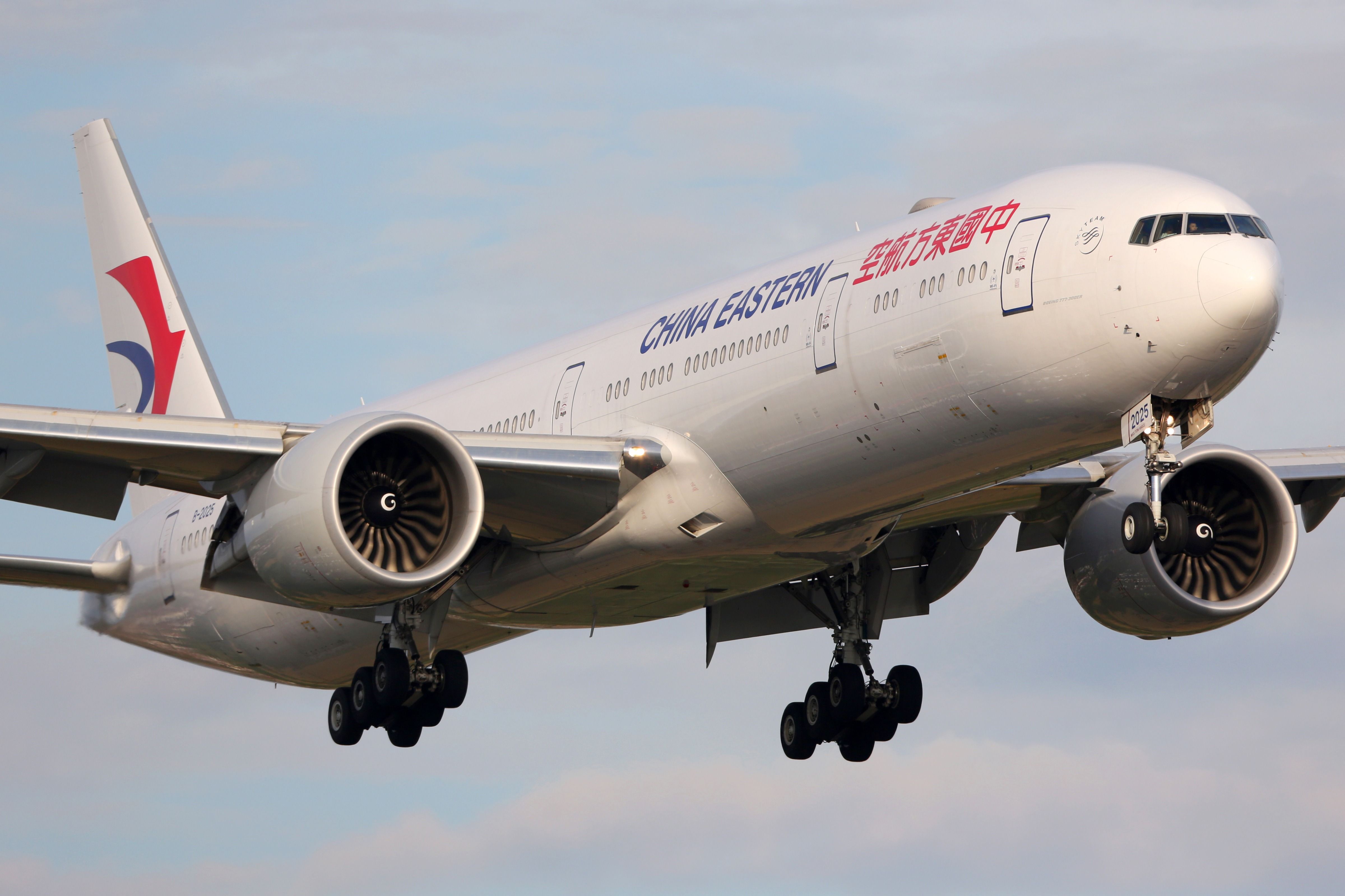 A China Eastern Airlines Boeing 777-300ER Flying in the sky.