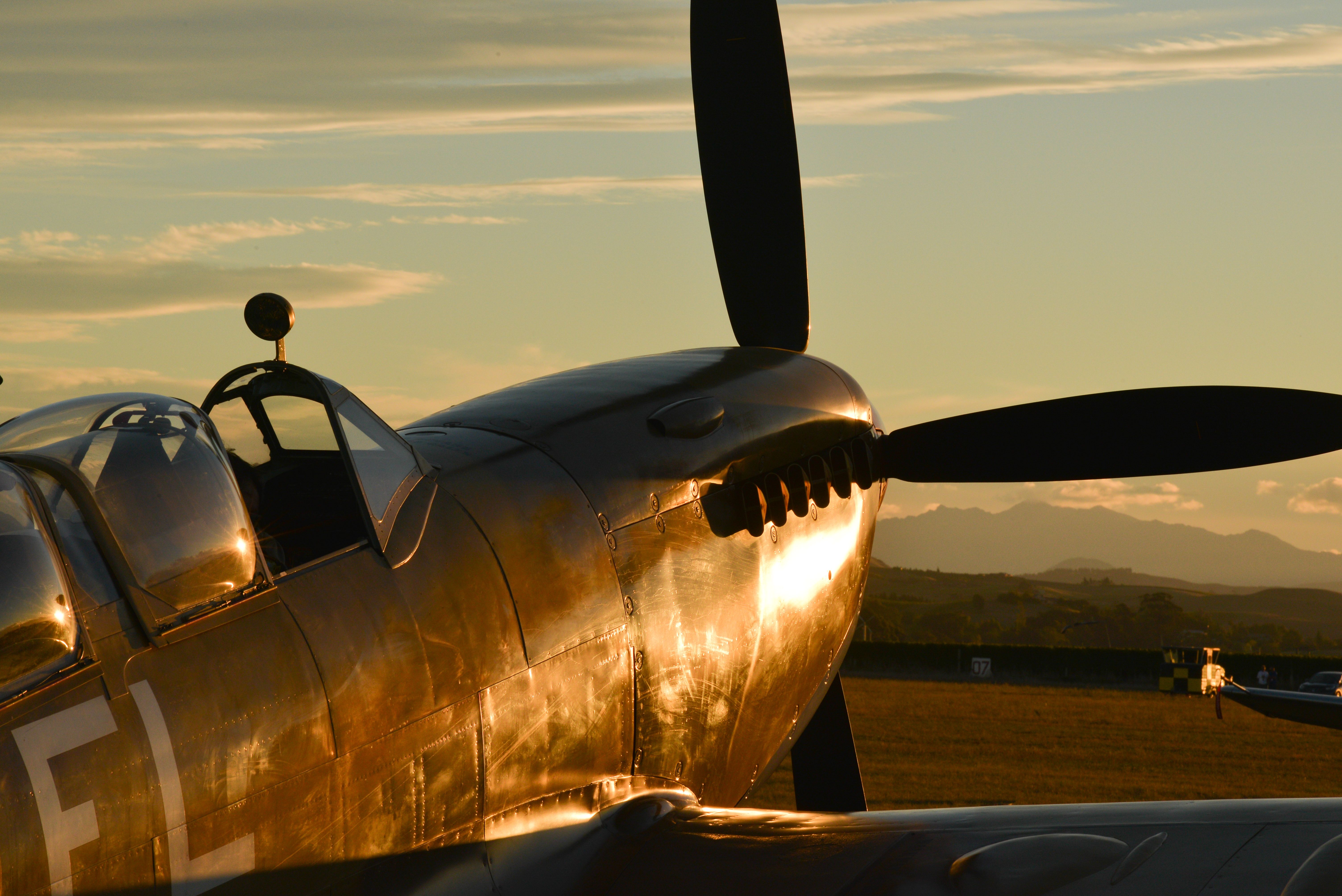 An aircraft parked during sunrise.