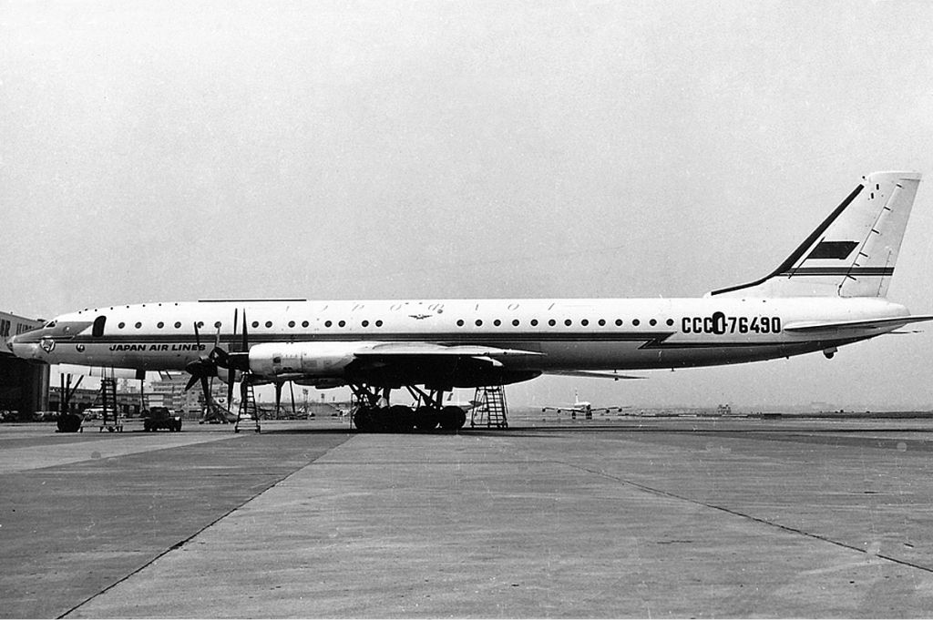 A Japan Airlines Tupolev Tu-114 parked on an airport apron.