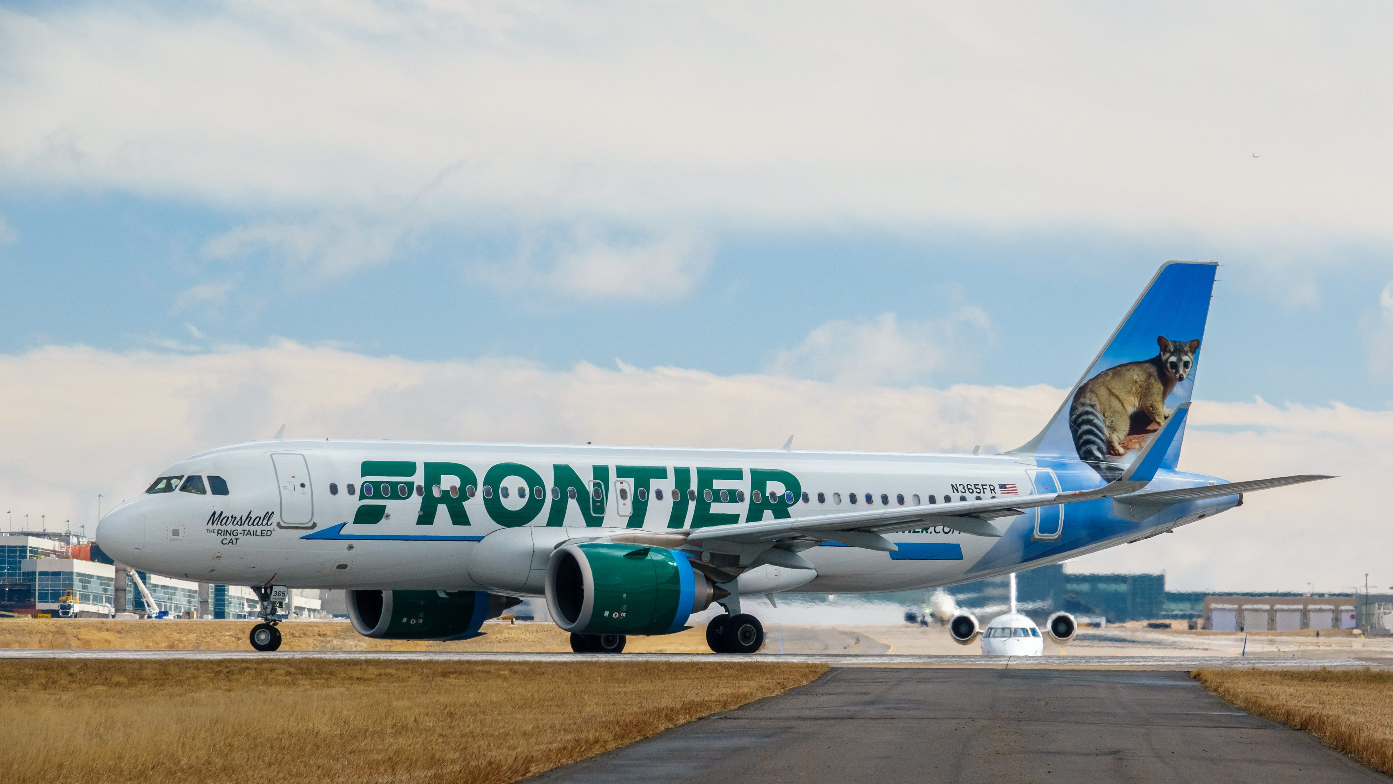 A Frontier Airlines plane gets ready for takeoff