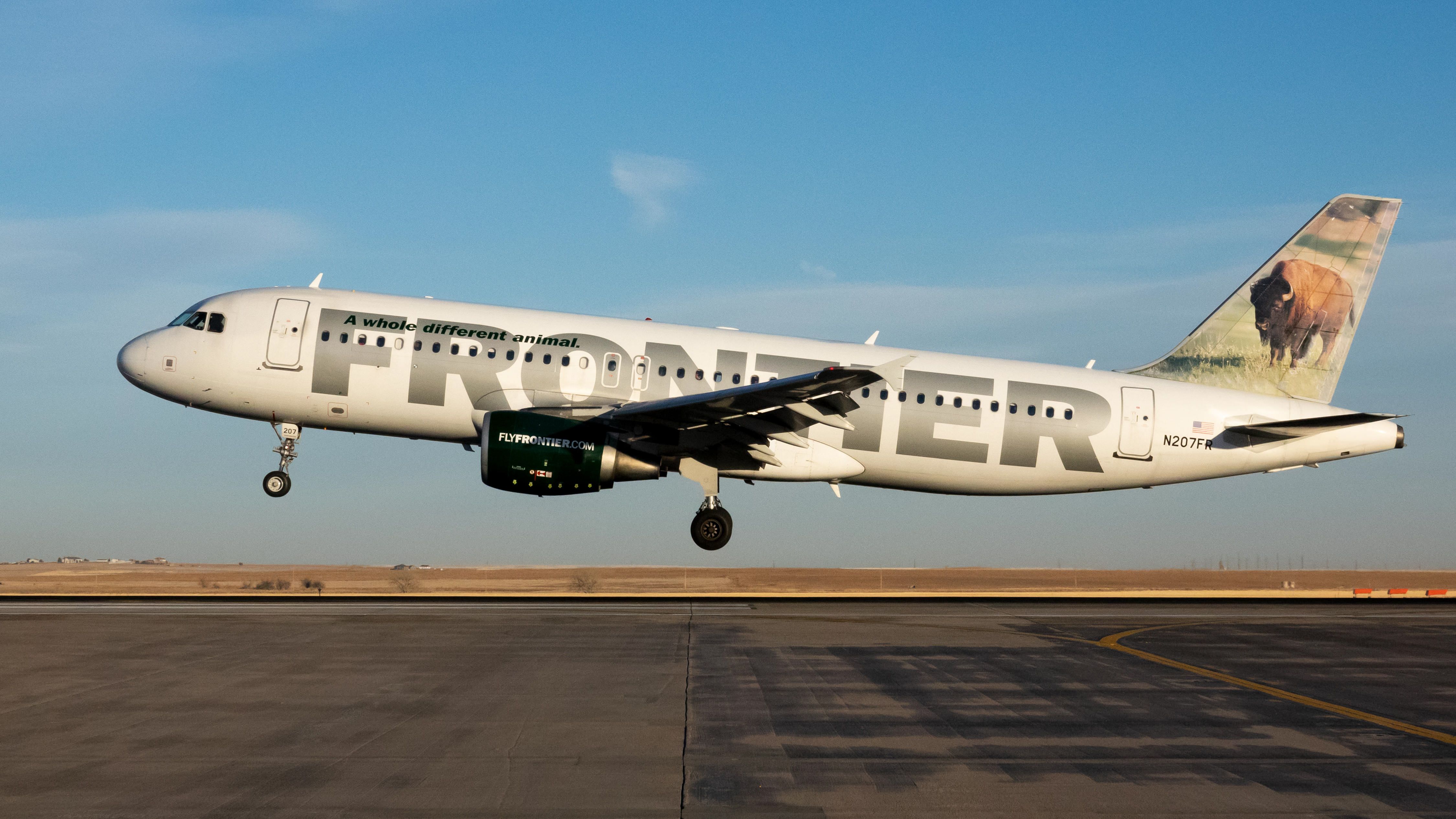 A Frontier Airlines plane at dusk