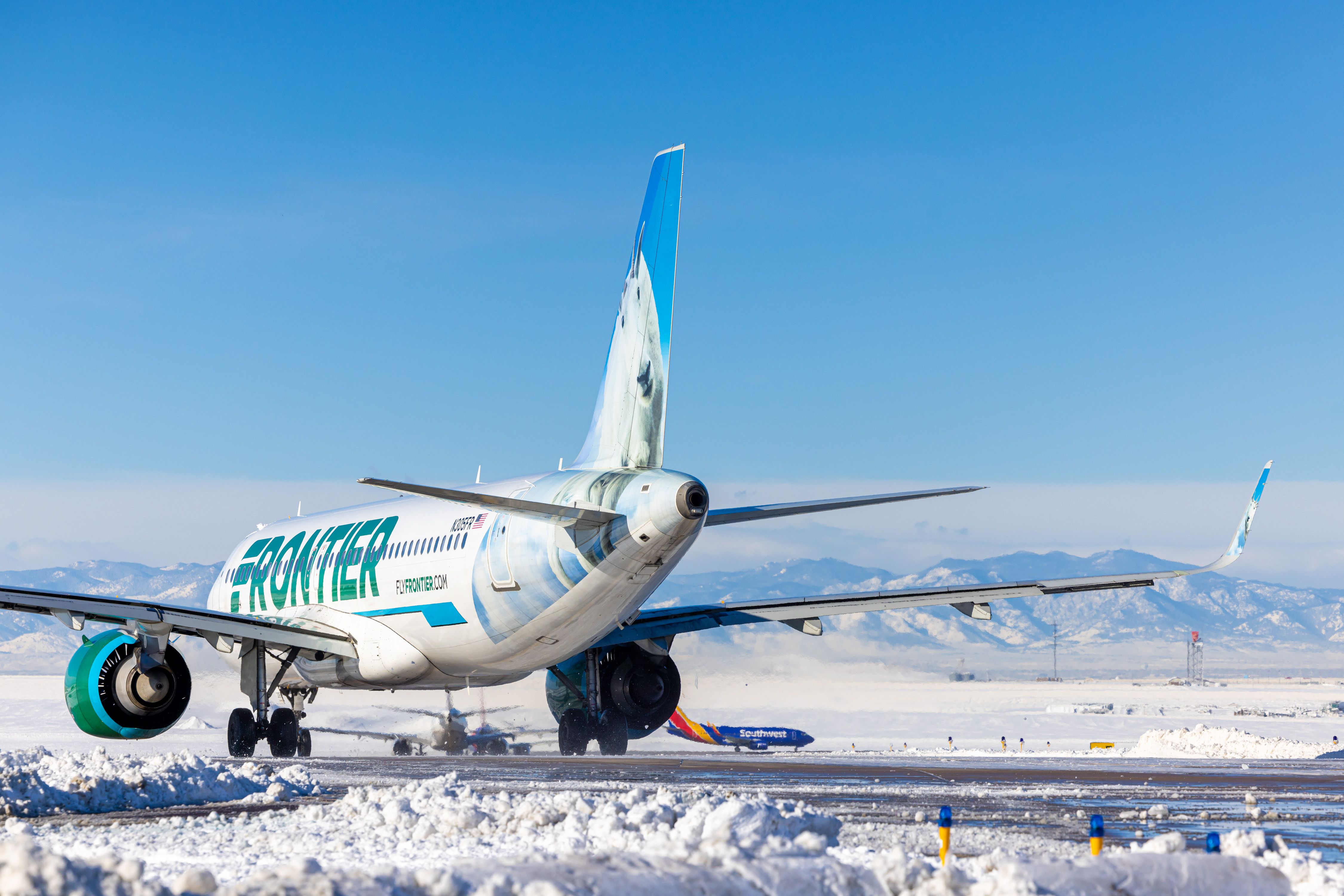 A Frontier Airlines plane in the snow