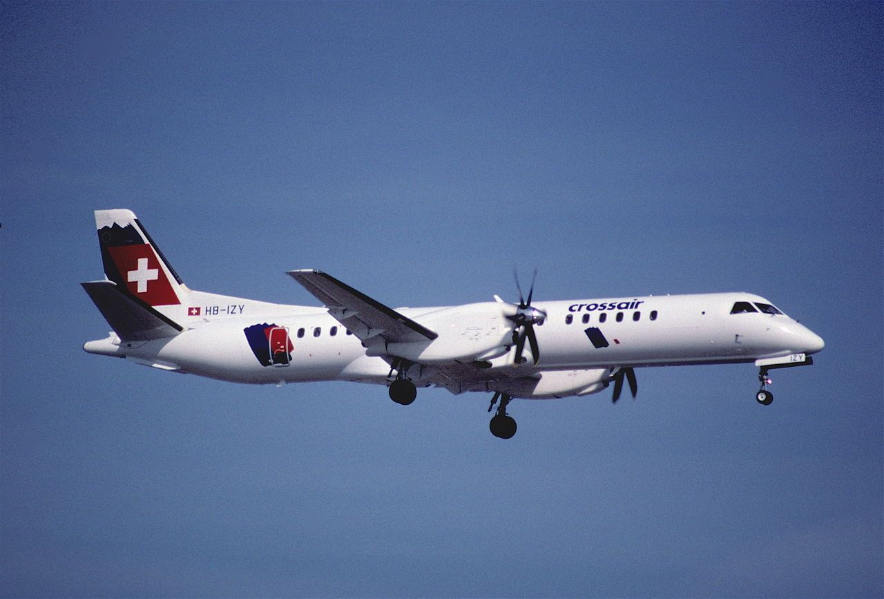 A Swiss International Air Lines Saab 2000 flying in the sky.