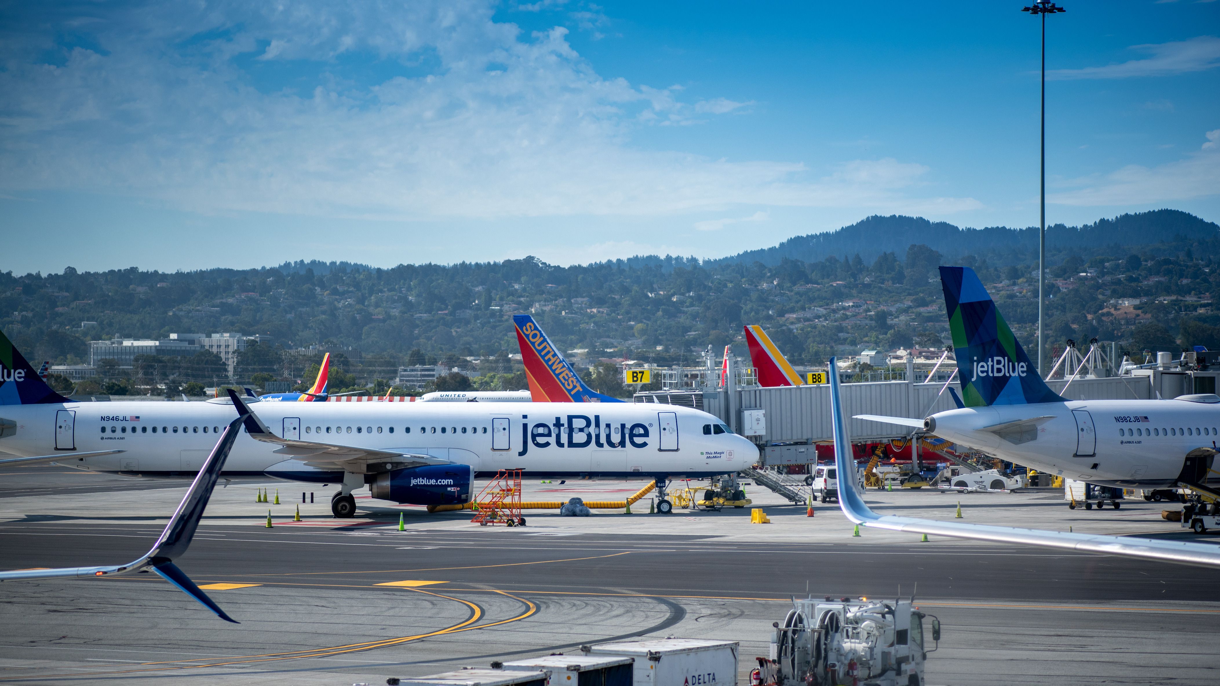 A Jetblue aircraft on the apron at San Francisco Airport.