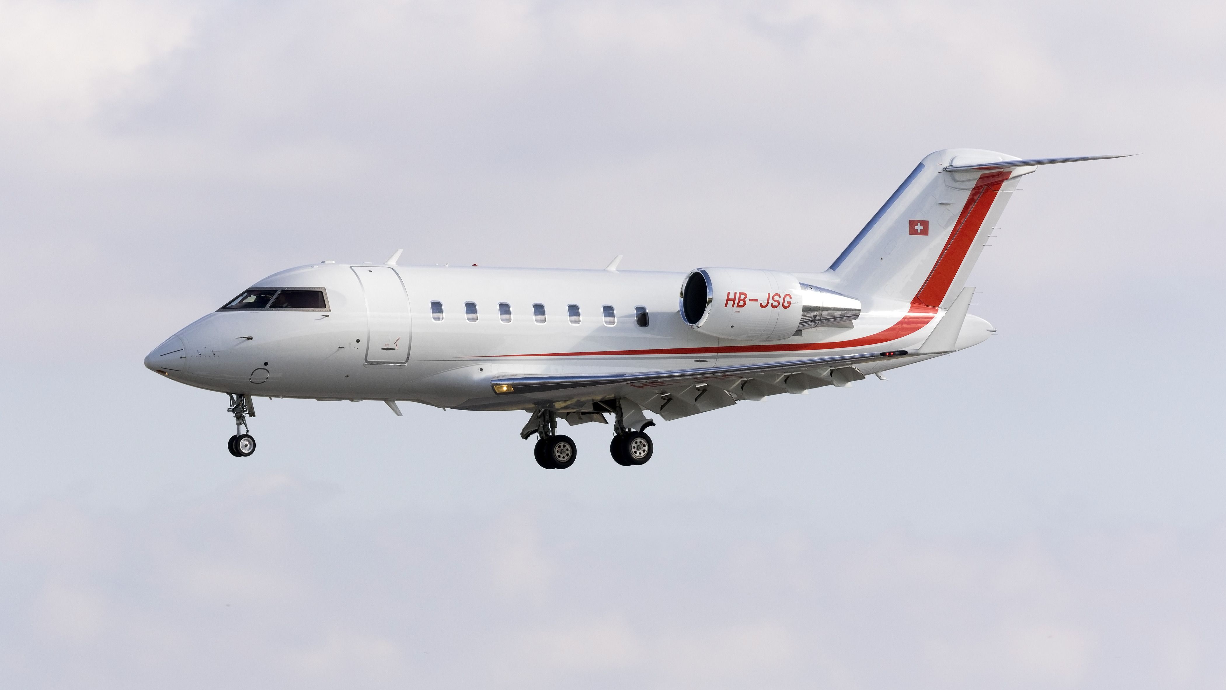A Bombardier Challenger 605 flying in the sky.