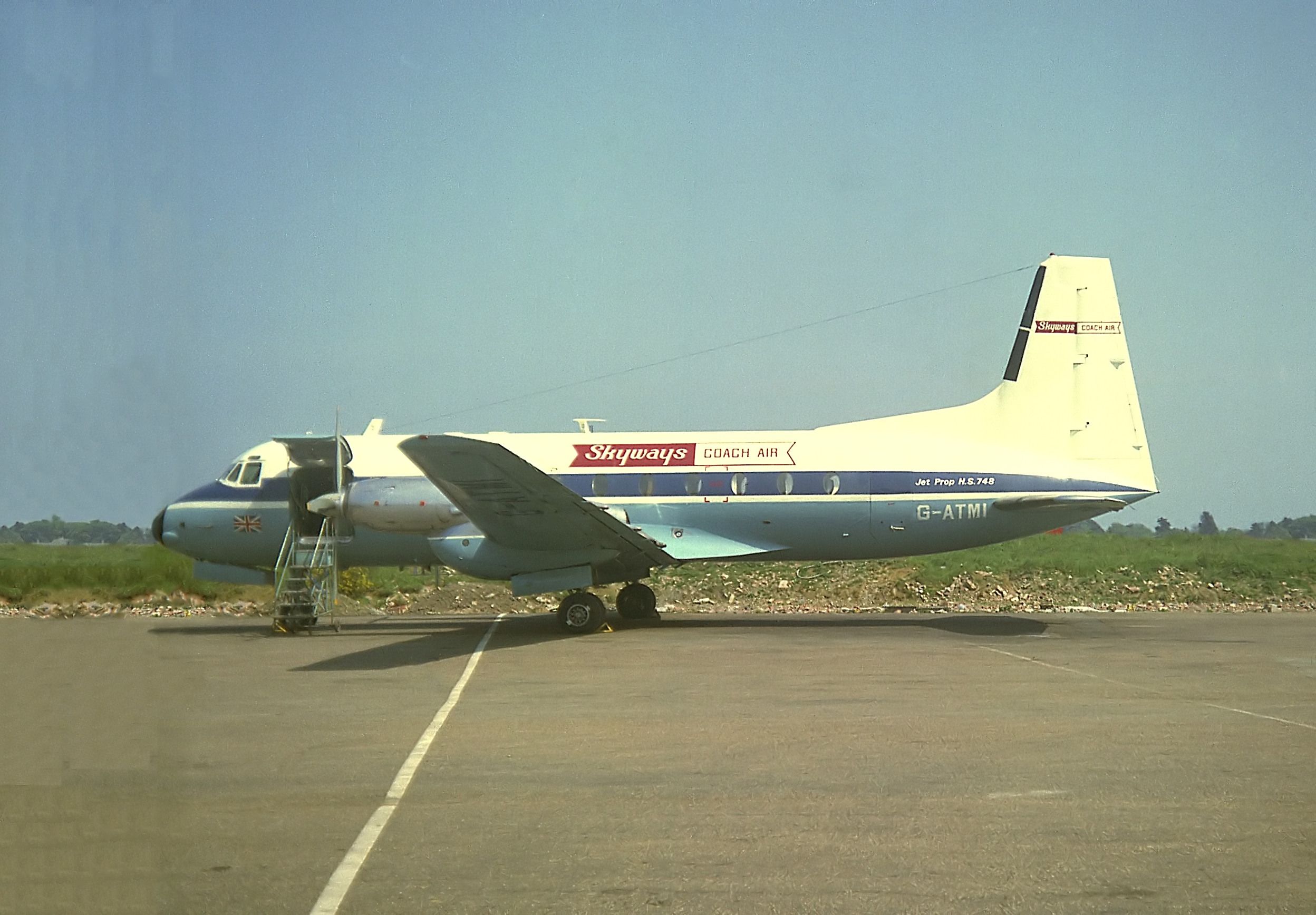 A Skyways Avro/HS 748 Parked On An Airport Apron.