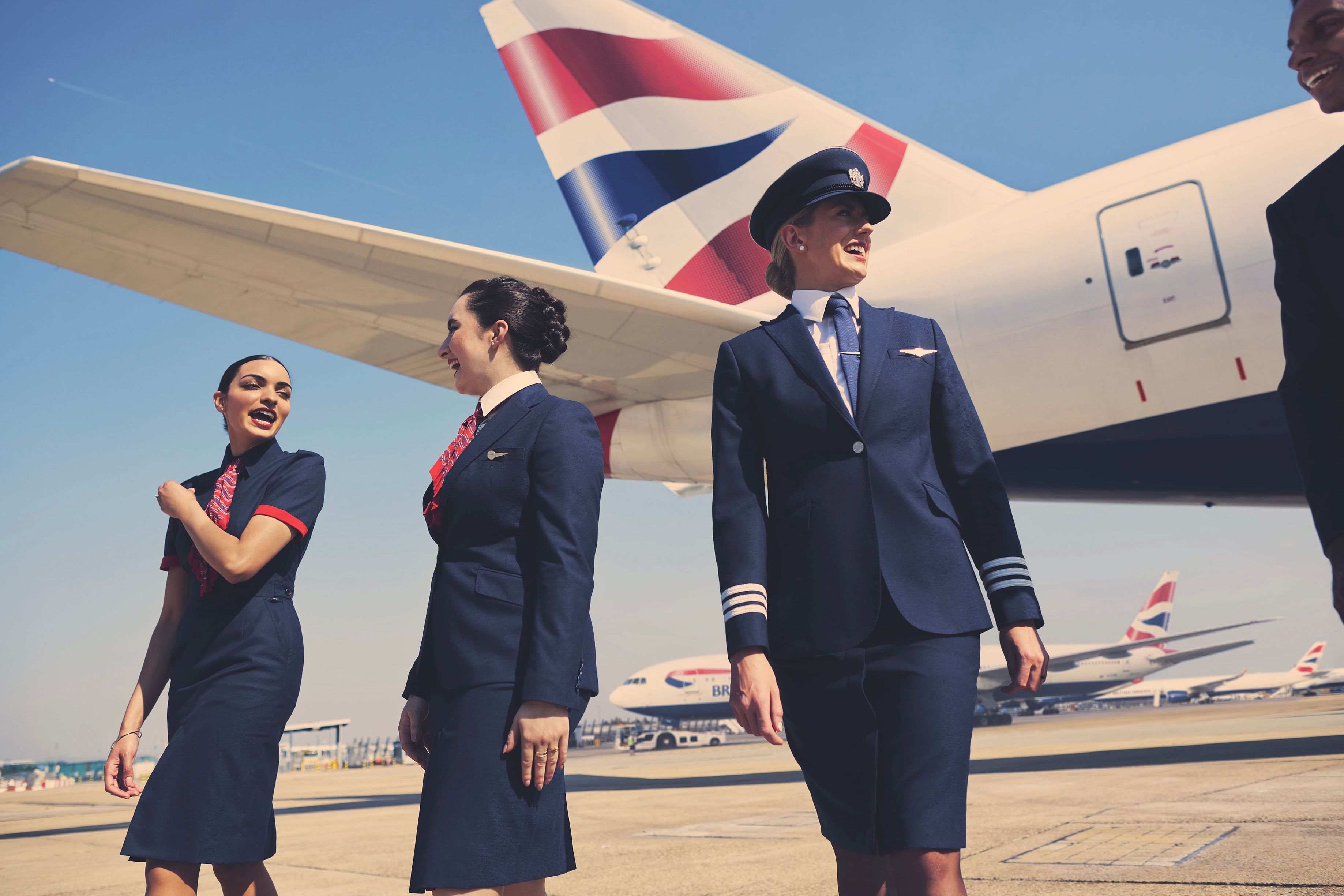 British Airways cabin crew and pilot and aircraft tail