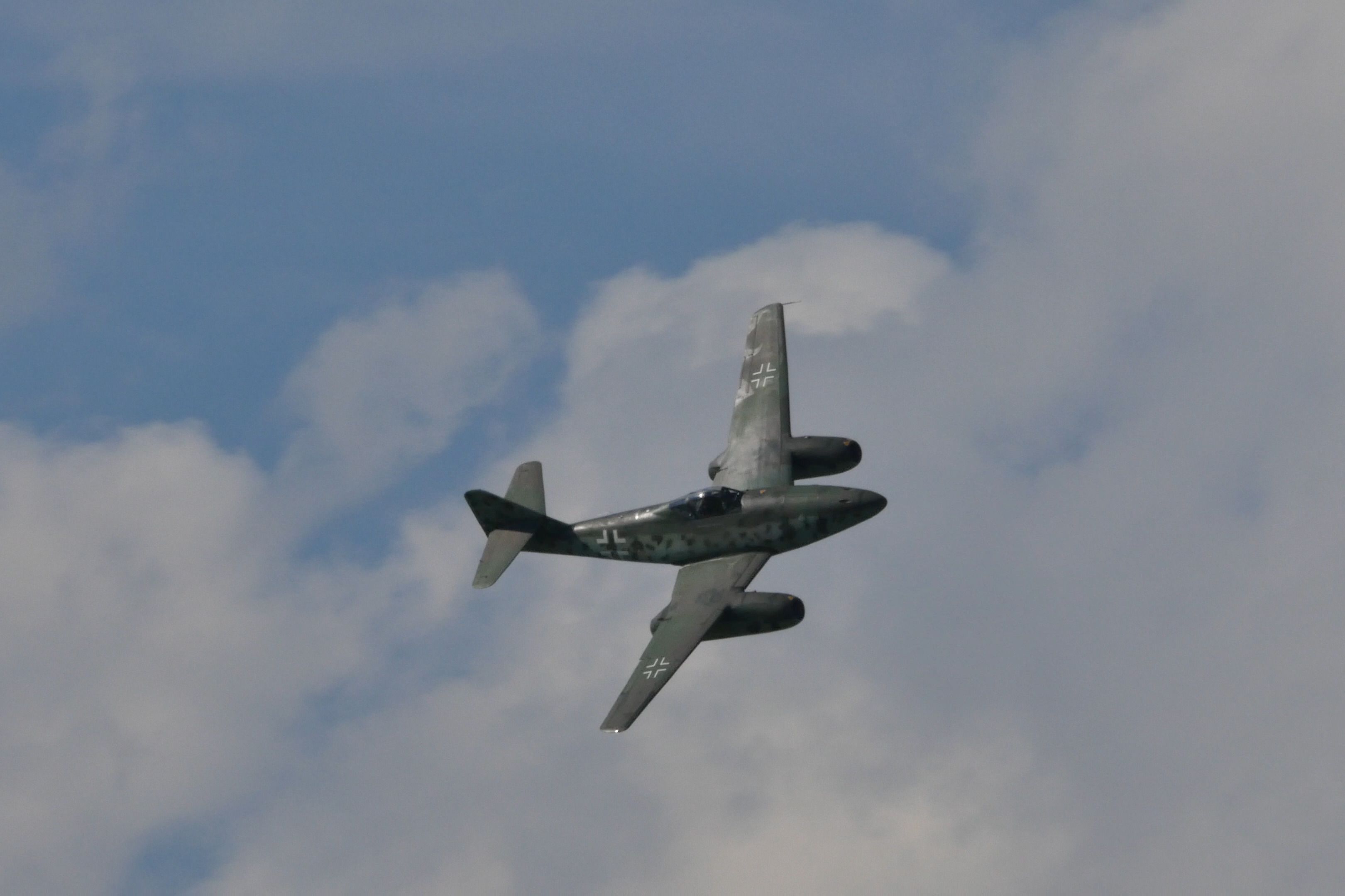 A Messerschmitt Me 262 Flying in the sky.