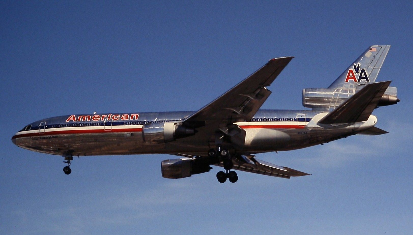 An American Airlines DC-10 flying in the sky.
