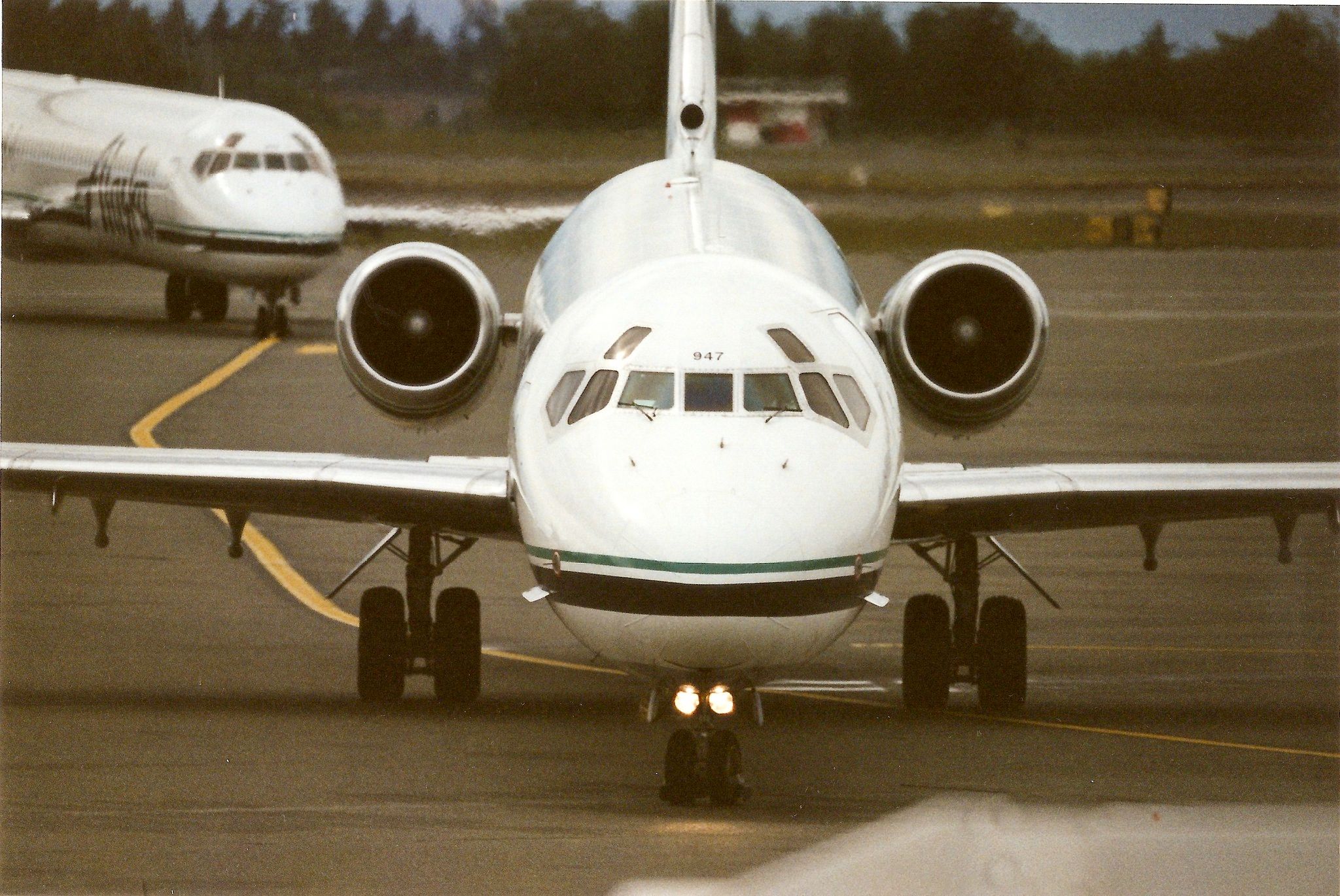 An Alaska Airlines MD-80 on an airport apron.