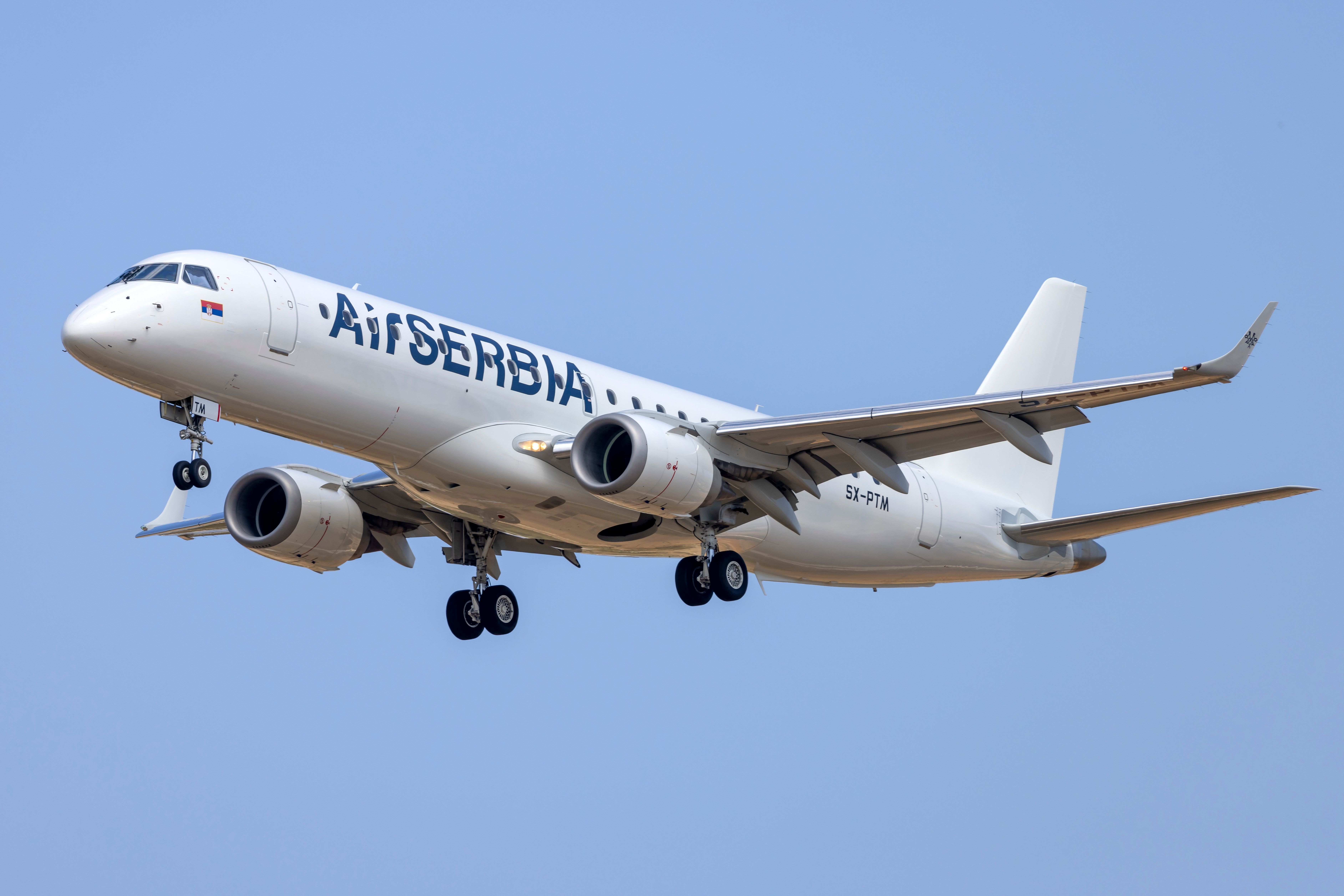 Air Serbia Embraer E195 landing at Luqa Malta International Airport MLA shutterstock_2323035351